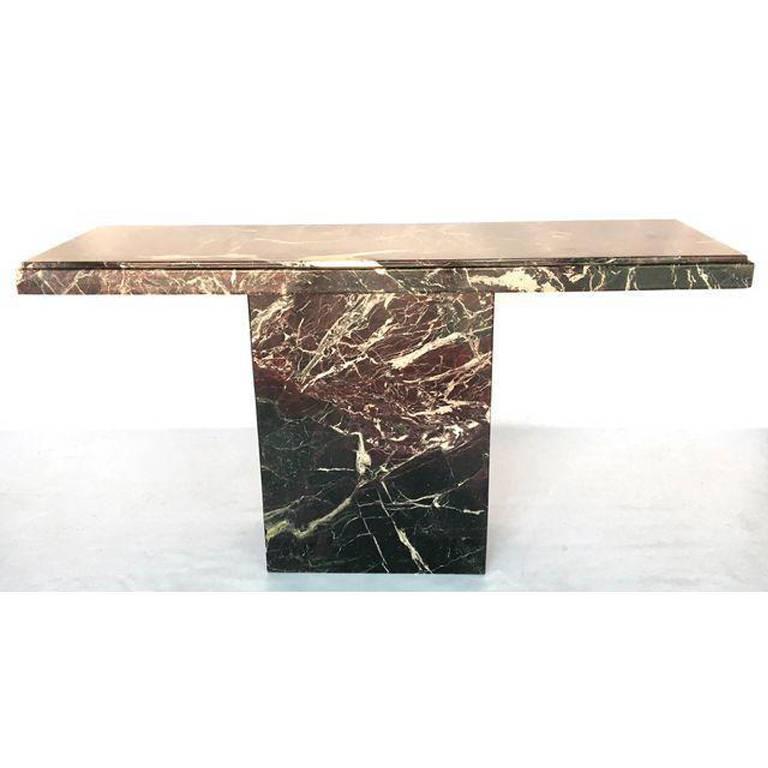 Marble console table in the Brutalist style. Marble pedestal with marble slap top. Excellent vintage condition with minor signs of age appropriate wear.