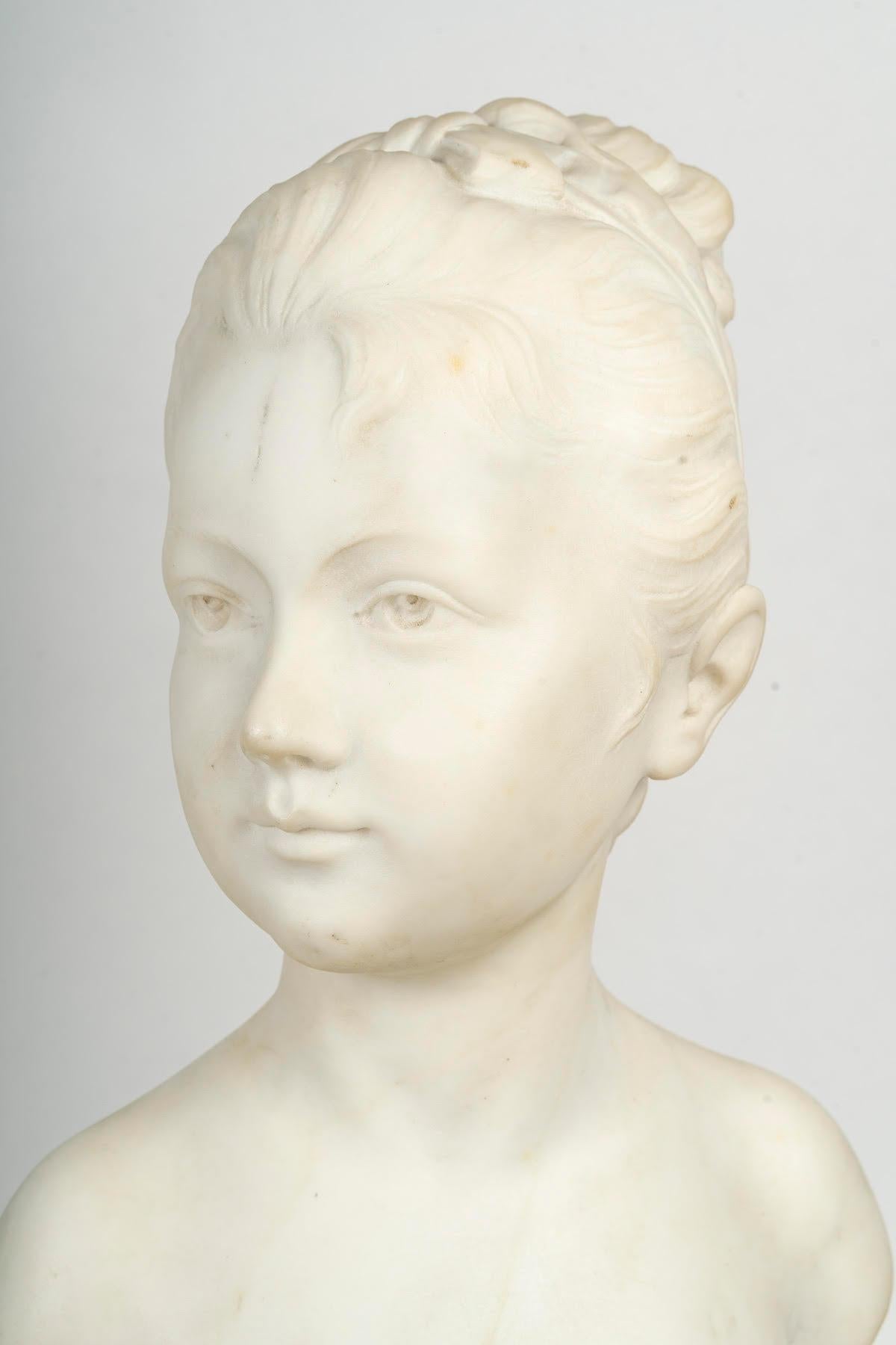 Marble bust after Houdon on its pendulum base, 19th century, Napoleon III period.

White Carrara marble bust after Houdon, representing a young girl, sculpture on its clock base by Susse Frères in bronze and marble from the 19th century, Napoleon