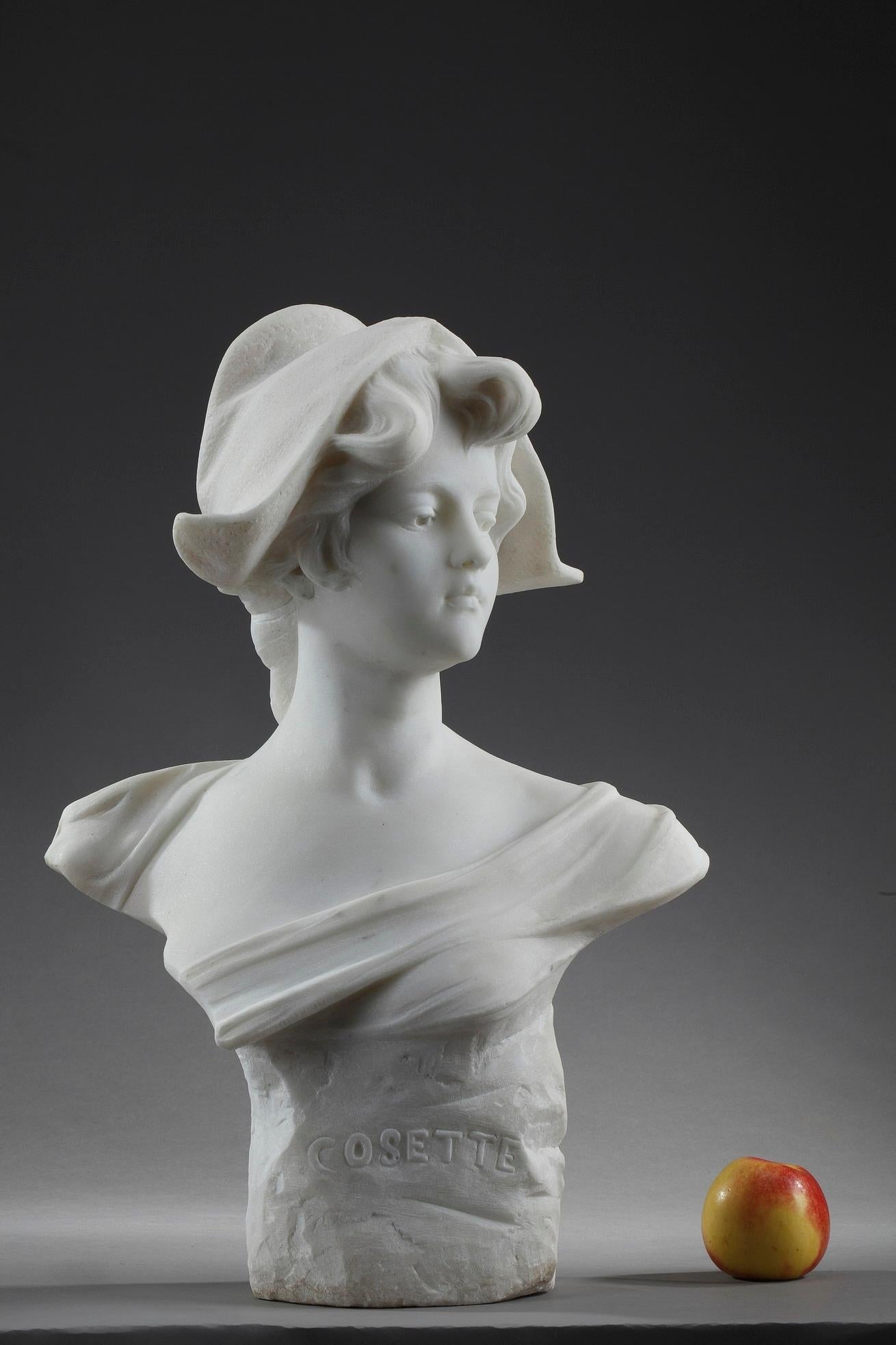 Large Art Nouveau white marble bust featuring Cosette, the heroine of Victor Hugo's novel Les Misérables (1862). She wears the Phrygian cap, symbol of freedom, which links her cause to that of the French nation. Cosette is depicted as a beautiful,