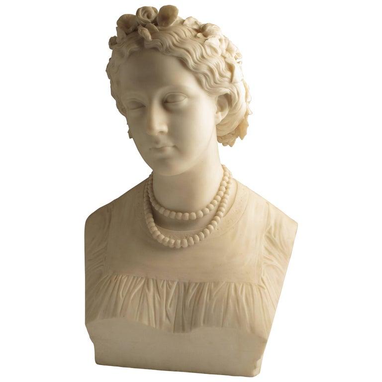 Marble Bust of a Young lady as Flora by John Adams-Acton (English, 1830-1910)
Signed and dated: JOHN ADAMS-ACTON FECT ROMA 1864 with inscription ELLEN A. HALL

White Marble

Provenance: Adams-Acton won the Royal Academy’s Gold Medal for sculpture in