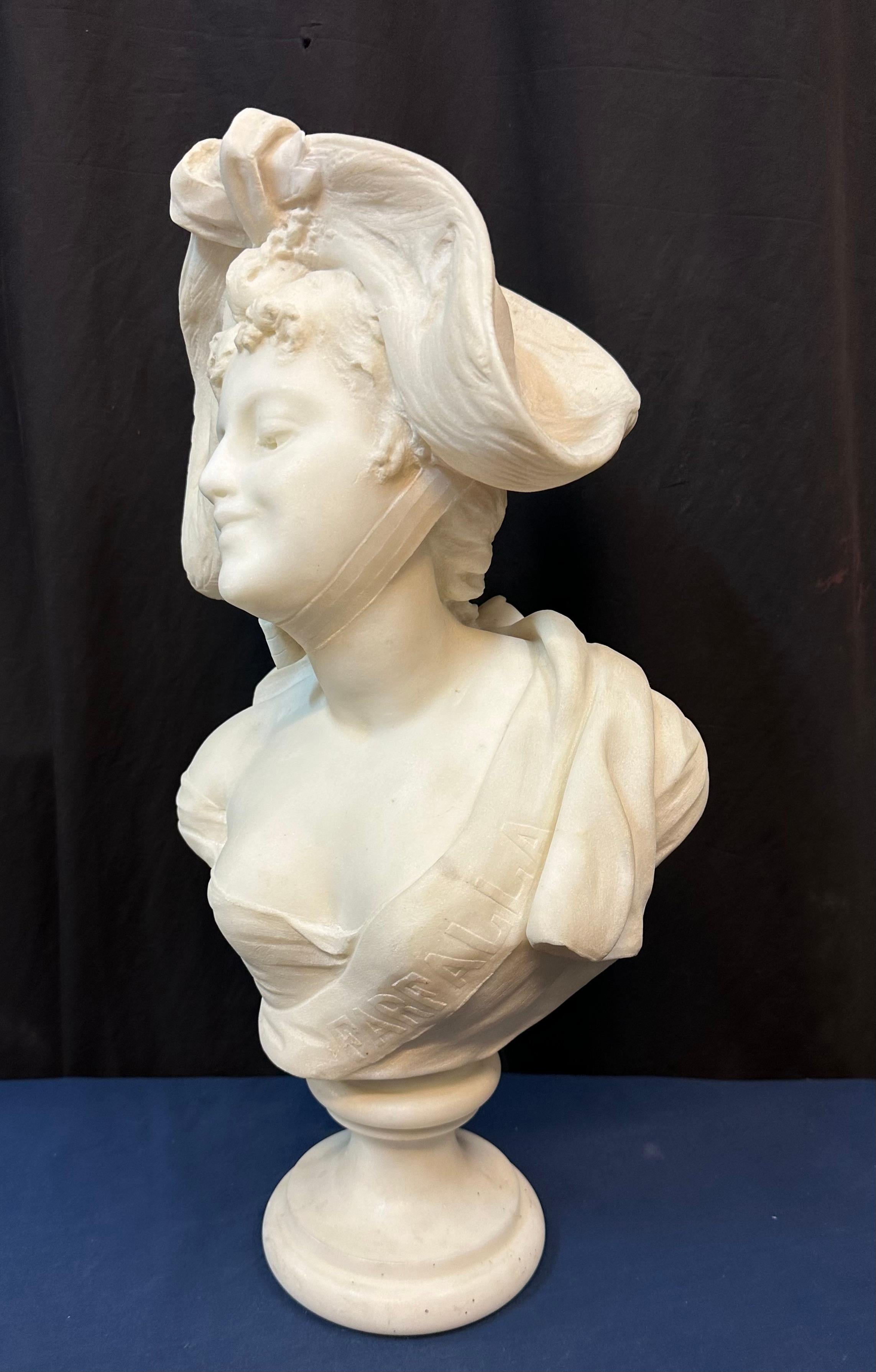 This vintage museum quality hand carved white Italian marble sculpture dates from the late 19th century. The sculpture features the bust of a young woman, beautifully rendered by famed artist A. Piazza. It is an exceptional work of art in very good