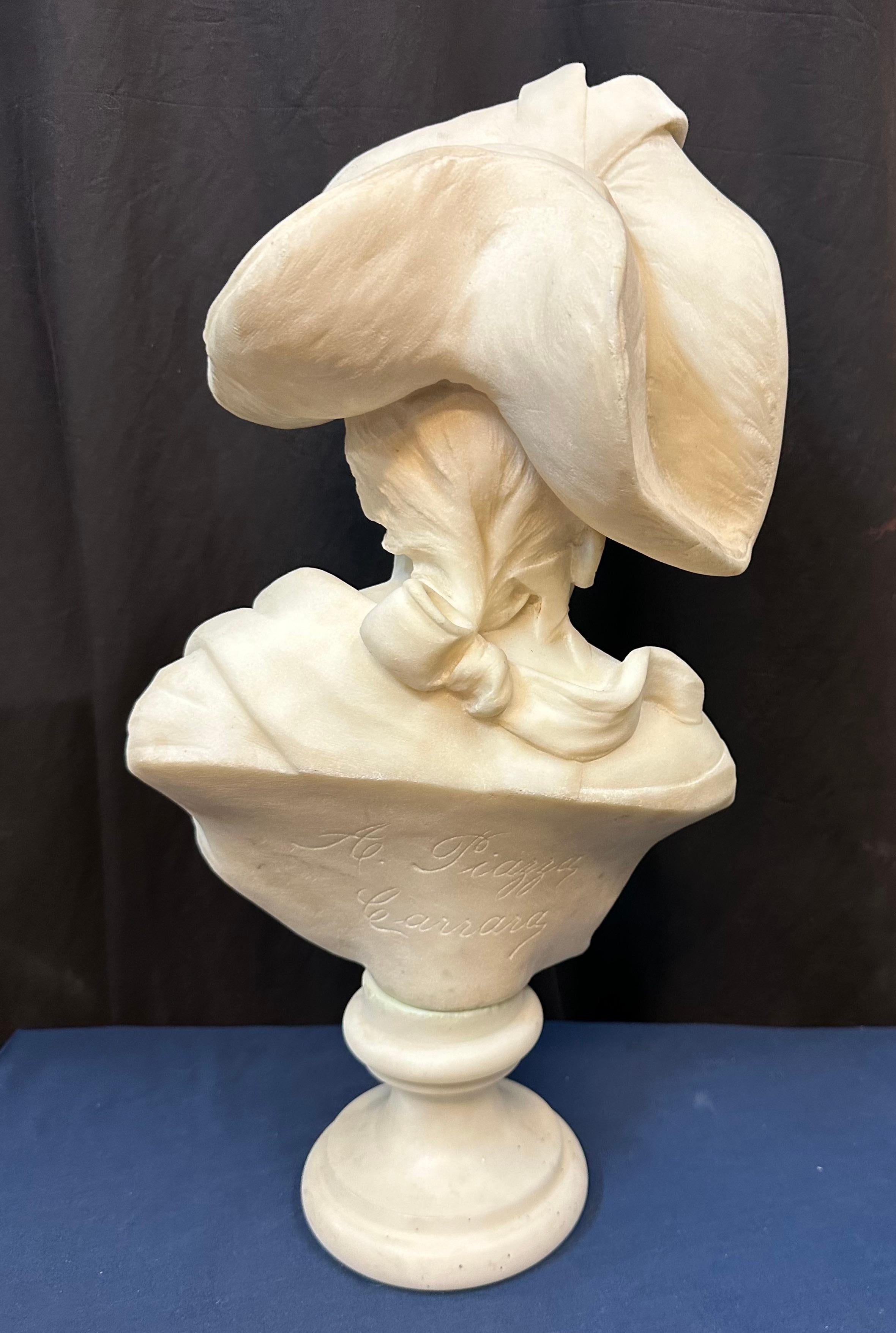 Carved marble bust of woman wearing a hat For Sale
