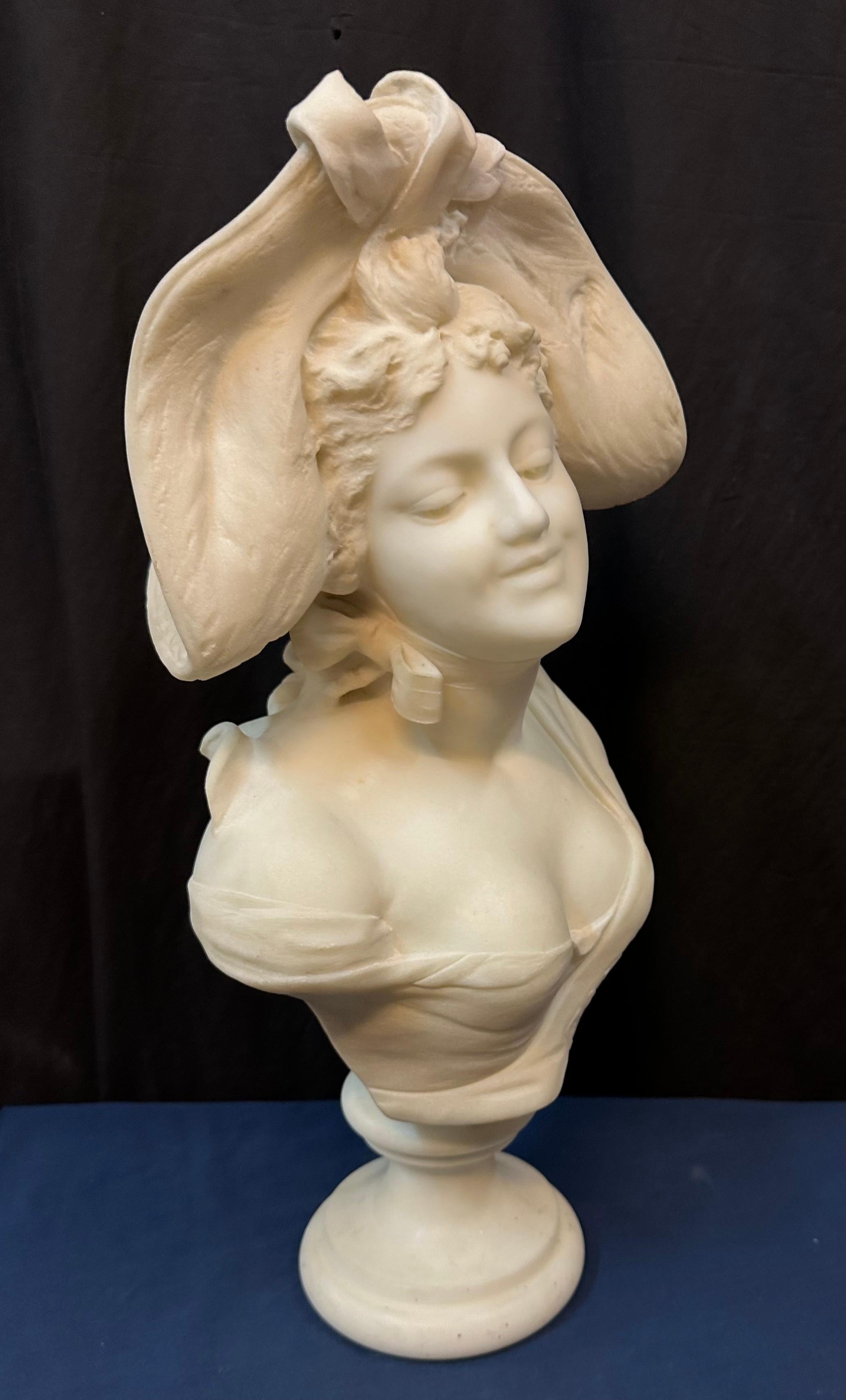 Marble marble bust of woman wearing a hat For Sale
