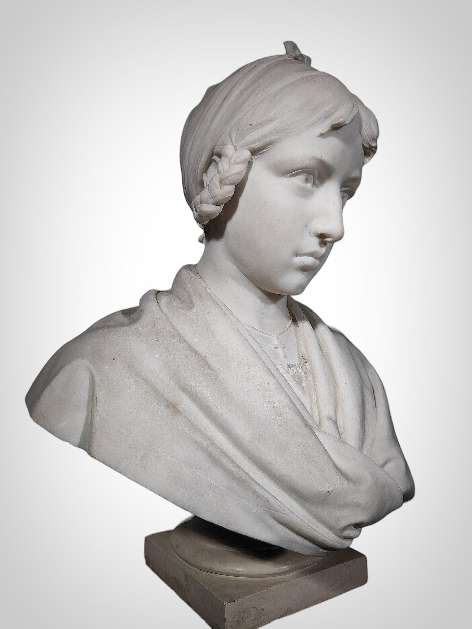 Product Description:

Material: White Carrara Marble
Size: Life-size
Representation: Young Girl
Signature: Illegible, dated 1927
Dimensions: 56 x 48 x 30 cm (height x width x depth)
Features and Details:
This elegant marble bust in white Carrara