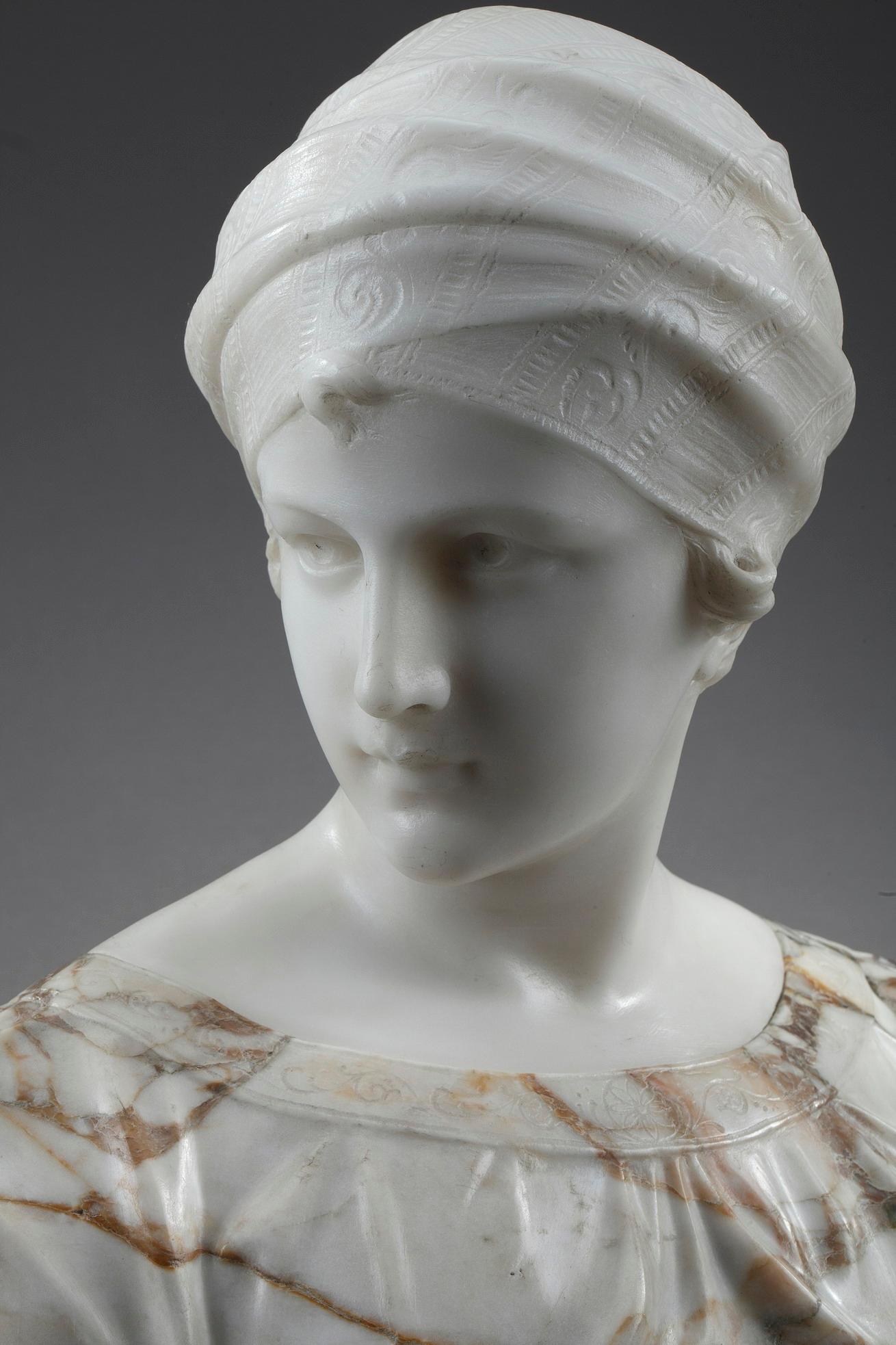 Late 19th century bust crafted in white marble and alabaster by Guglielmo Pugi (circa 1850-1915), Italian sculptor active in Florence between 1870 and 1915. The portrait captures the noble visage of a woman wearing a turban. The turban and dress are