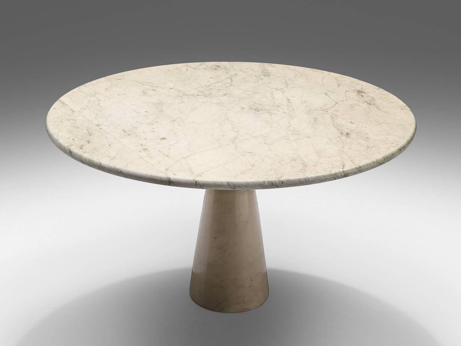 Dining table, marble, Europe, 1970s. 

This architectural marble table is a skillful example of postmodern design. The circular table features no joints or clamps and is architectural in its structure featuring one single column. The veined top is