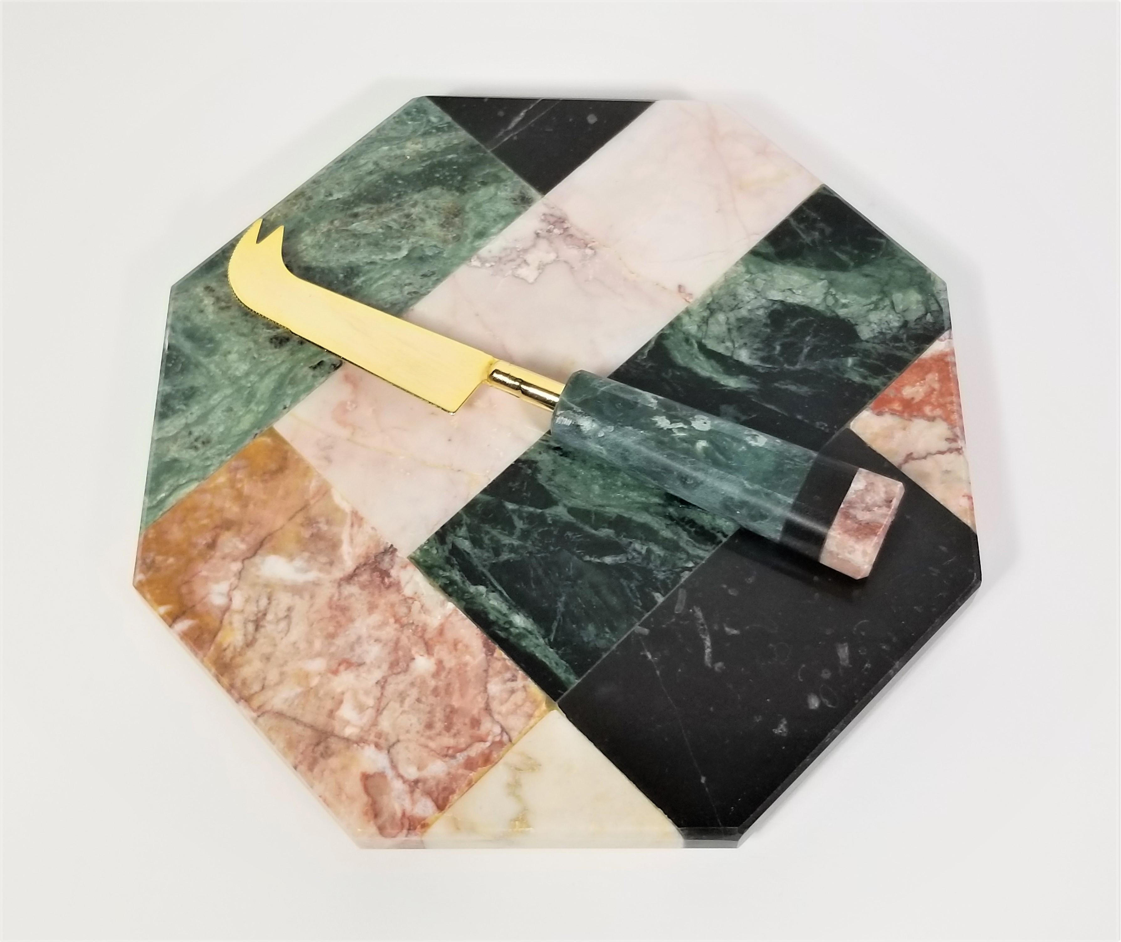 1970s Marble Cheeseboard set. Multicolored Marble. Footed Board. Matching Knife / Spreader. Original Satin Holder. Cheeseboard and Knife are in Excellent Condition.