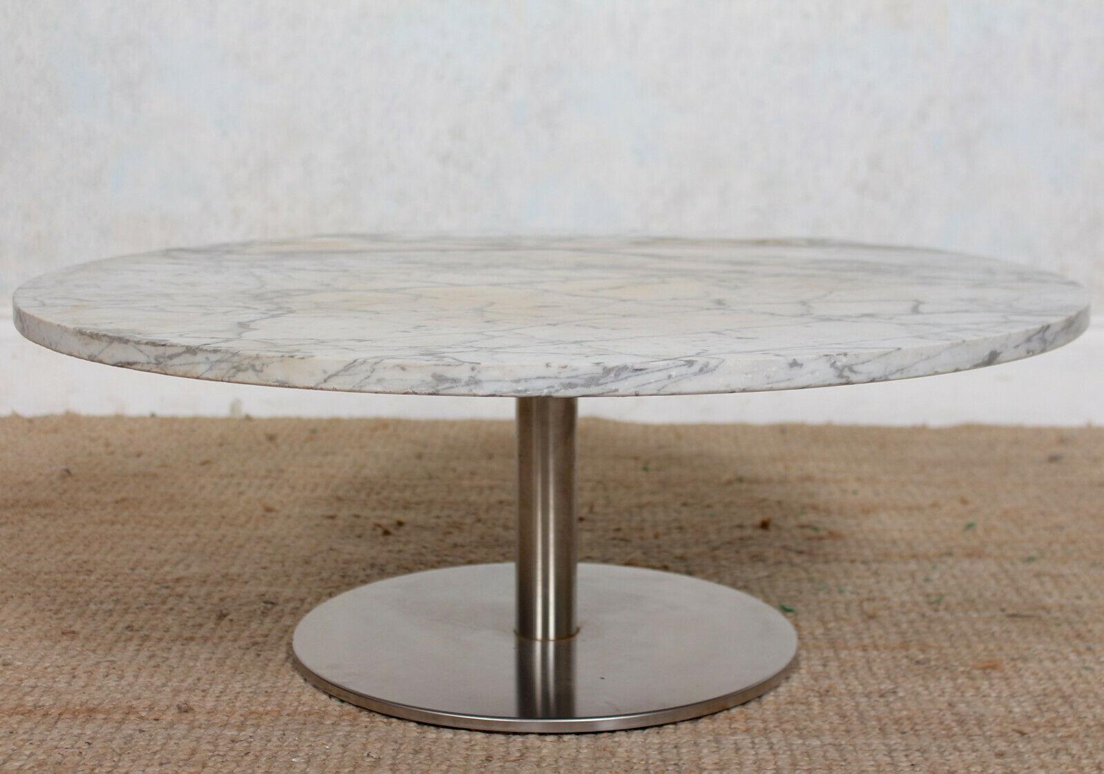An impressive mid-20th century marble coffee table.

The circular marble top raised on a chromed column and base.

European, circa 1970.