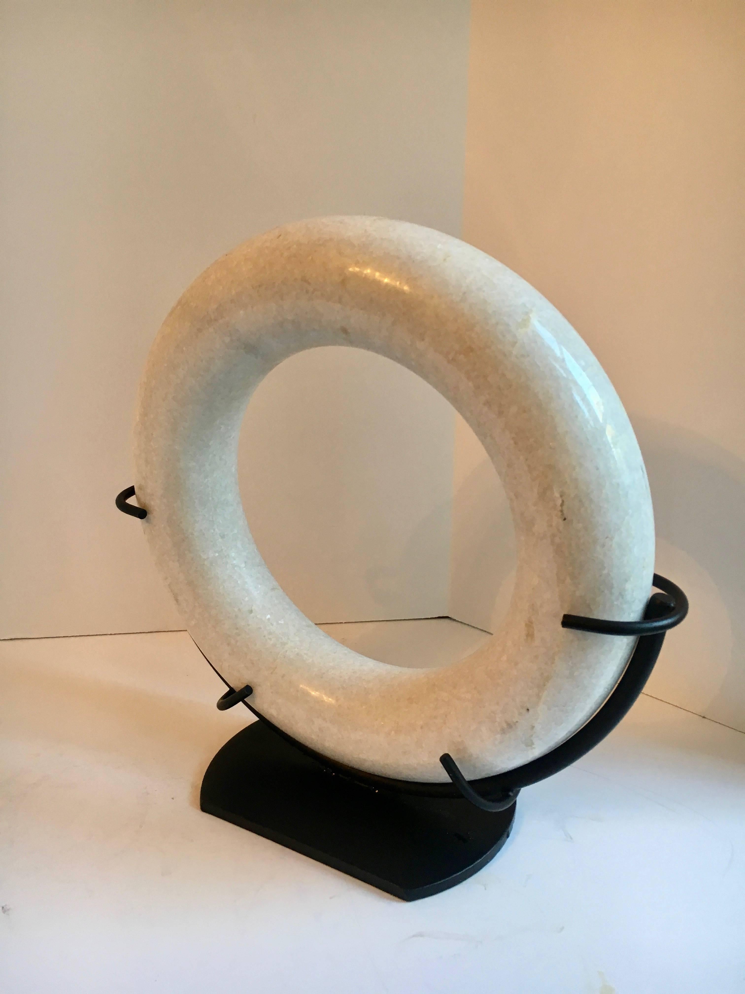circular sculpture on stand