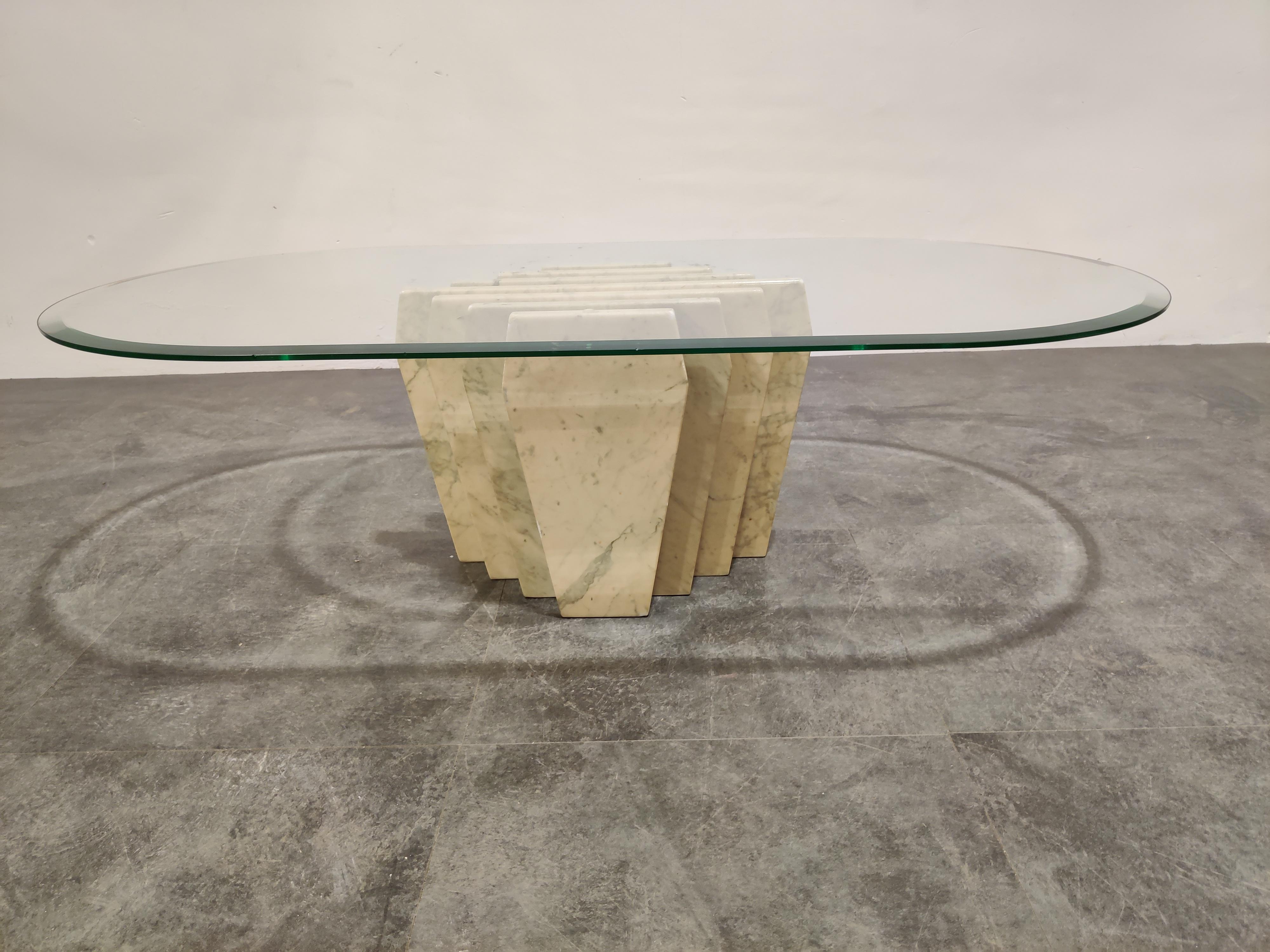 Vintage marble slabs coffee table.

Architectural table base with a beveled oval glass top. 

The table base has some chips on the top corners but has still a good overall look. Glass is fine. 

1980s, Italy

Dimensions:
Height