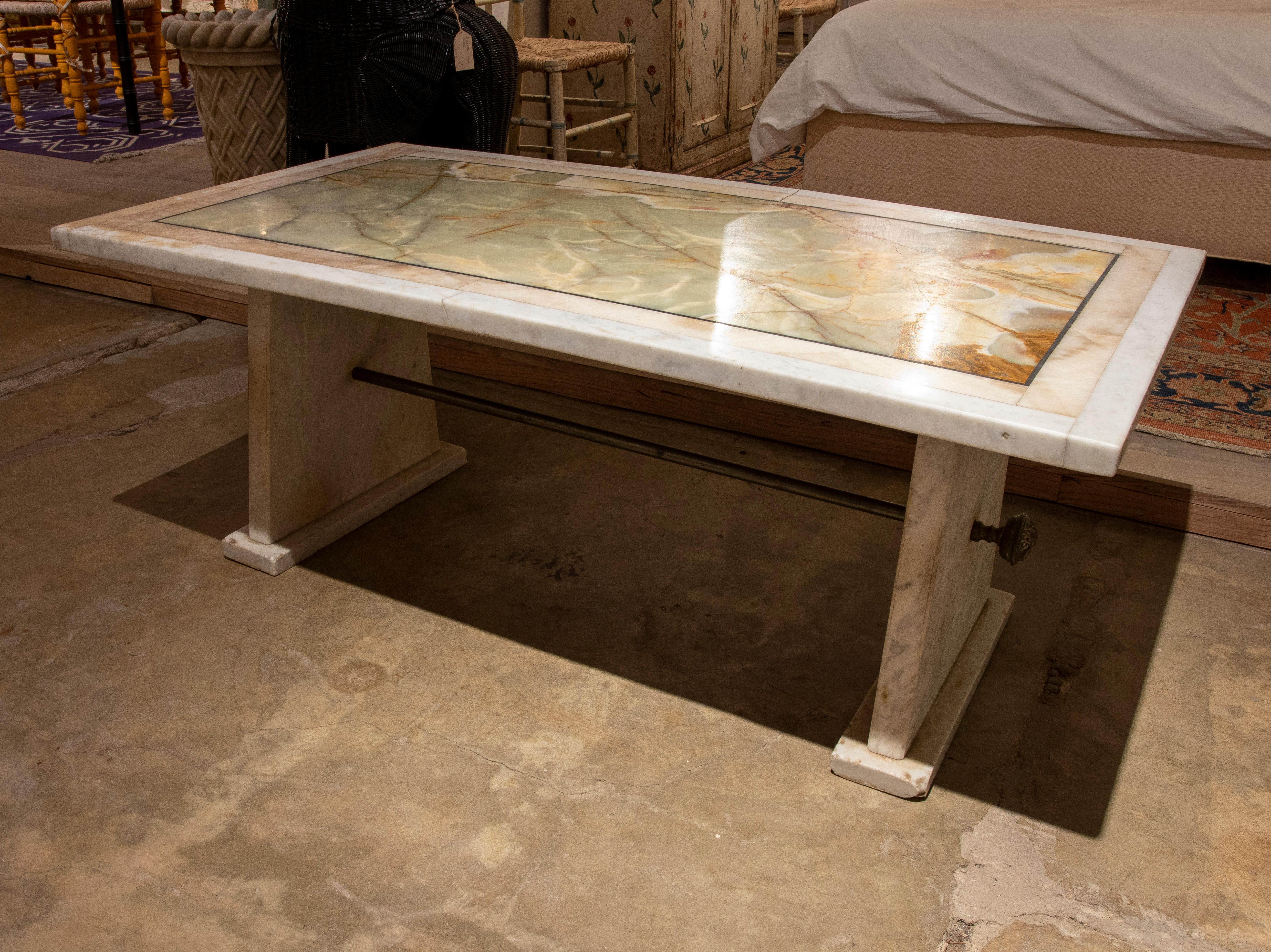 Marble coffee table with onyx and marble top with bronze decorations.