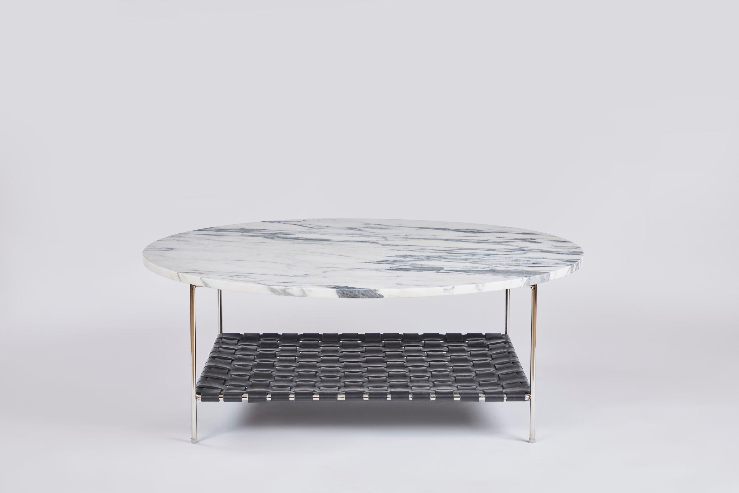 Each marble top is selected for its unique qualities.

The leather shelf is woven by a master weaver.

We use 70% recycled steel for the frame.

Designed by a former art dealer who represented contemporary artists for over 30 years including some of