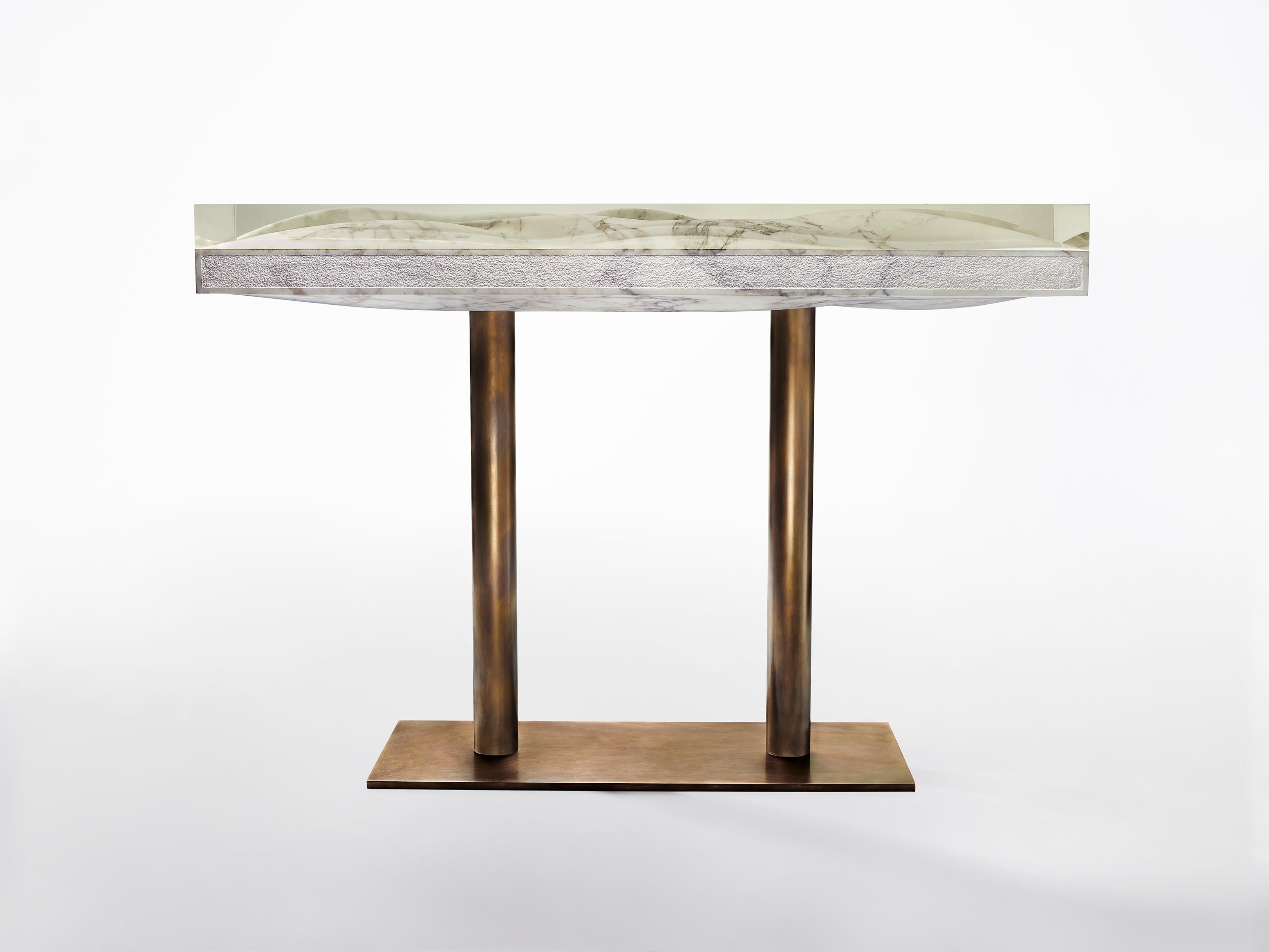 Marble console by Jonathan Hansen
9 Editions + 1 AP
Dimensions: 127 x 40.6 x 86.4 cm
Materials: Calacatta marble, architectural bronze, resin


SERIES I CAPTUM BIOMORFE is a group of nine sculpture works created by New York artist Jonathan