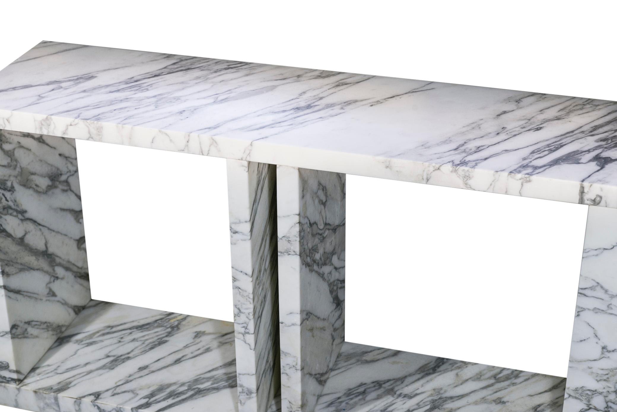 Ettore Sottsass (1917-2007), Console 
Large console with a white marble structure with gray veins
Terrace accommodating two curved side uprights and two rectilinear central uprights, rectangular top
Circa 1980, Italy.

Measures: Height 70 cm, length