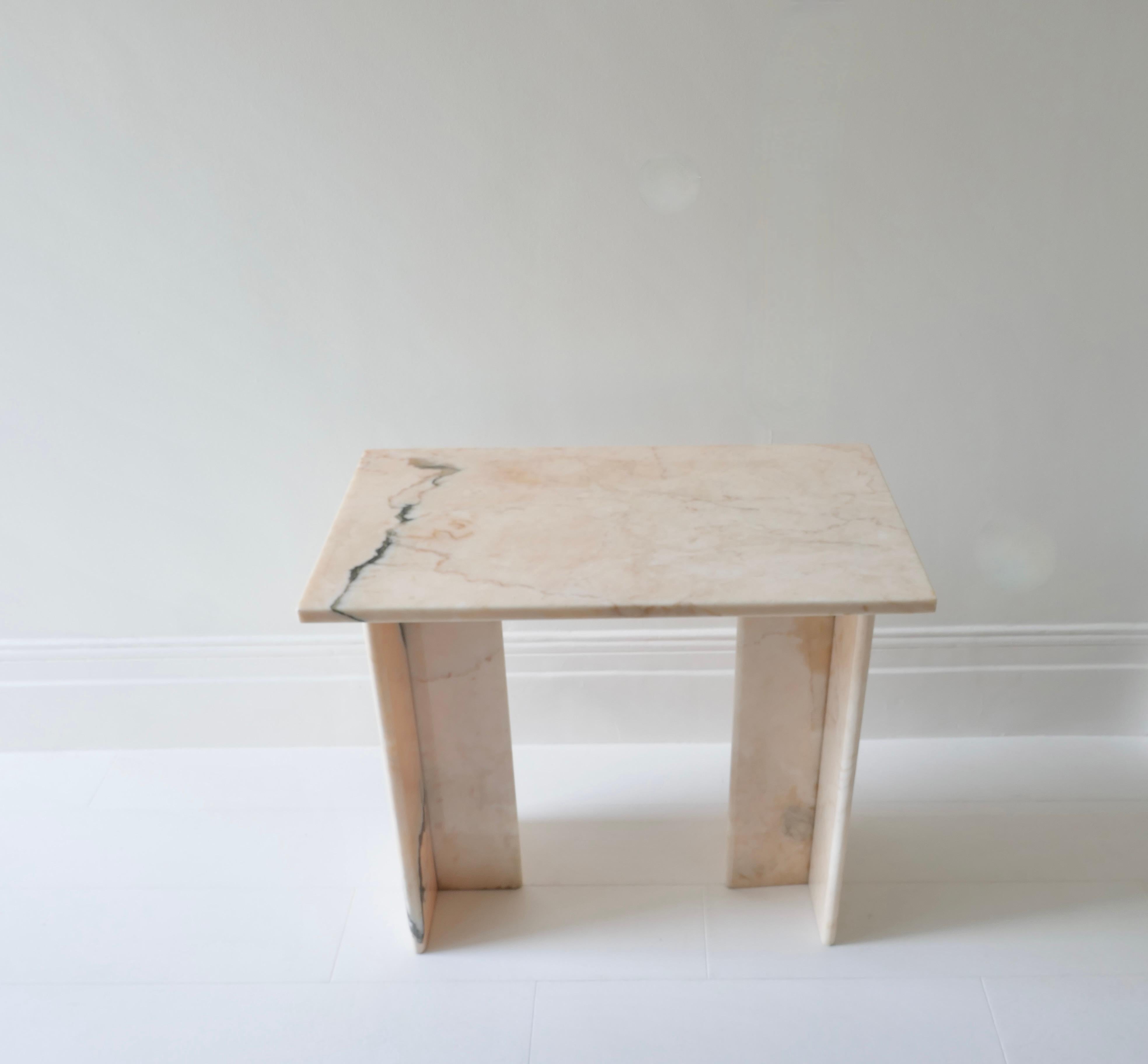 An original small table in Pink Portuguese marble with black veins.
Its unique size makes it adaptable to many uses : as a small console, a small desk or a vanity table. 
A delicate pink colour with black veins adding character and substance.
Top