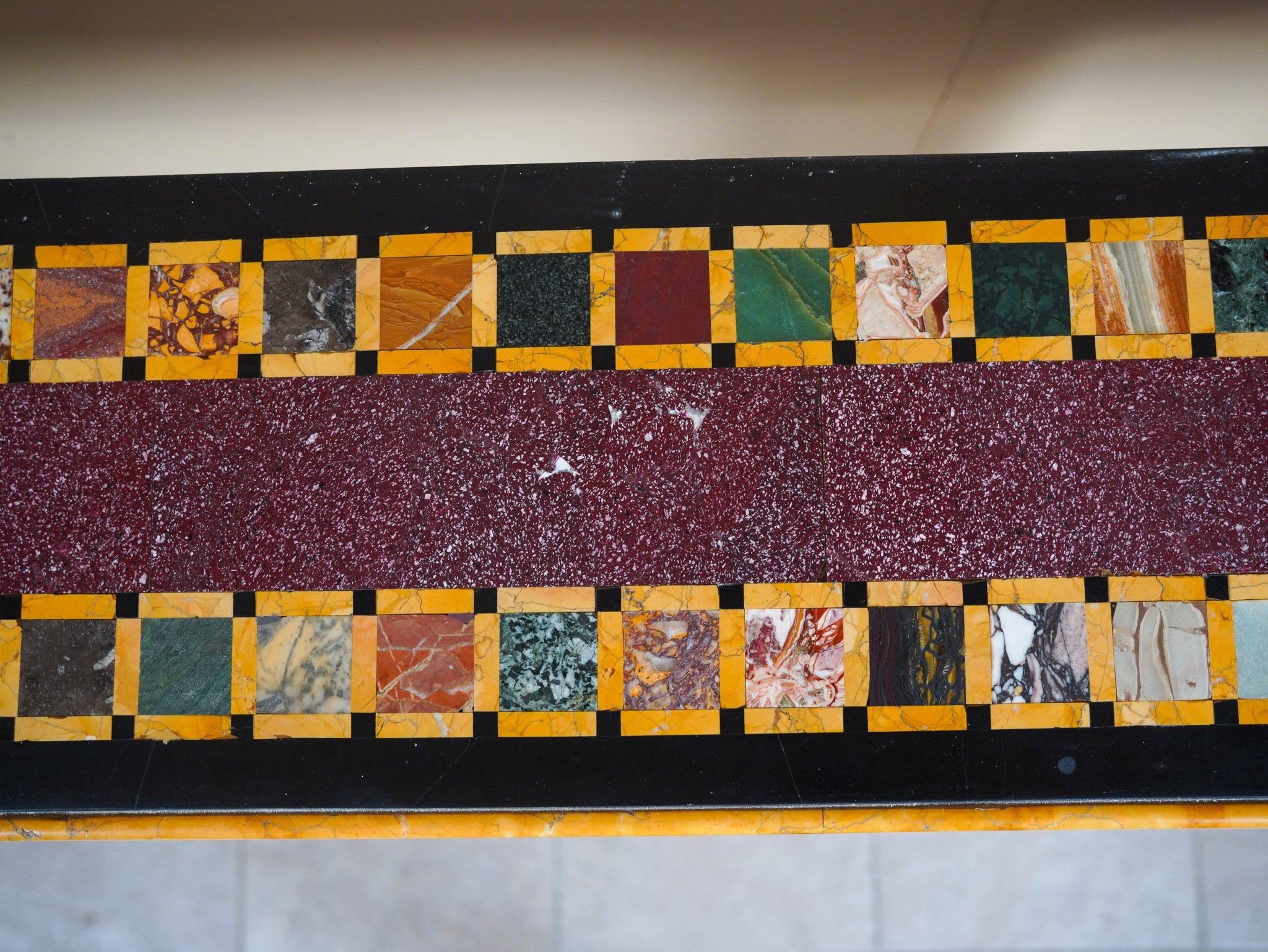 Consolle with a marble top featuring various samples, a Porphyry central section, Carrara marble bases with Porphyry inserts, and Giallo Antico marble details. ADDITIONAL PHOTOS, INFORMATION OF THE LOT AND SHIPPING INFORMATION CAN BE REQUEST BY