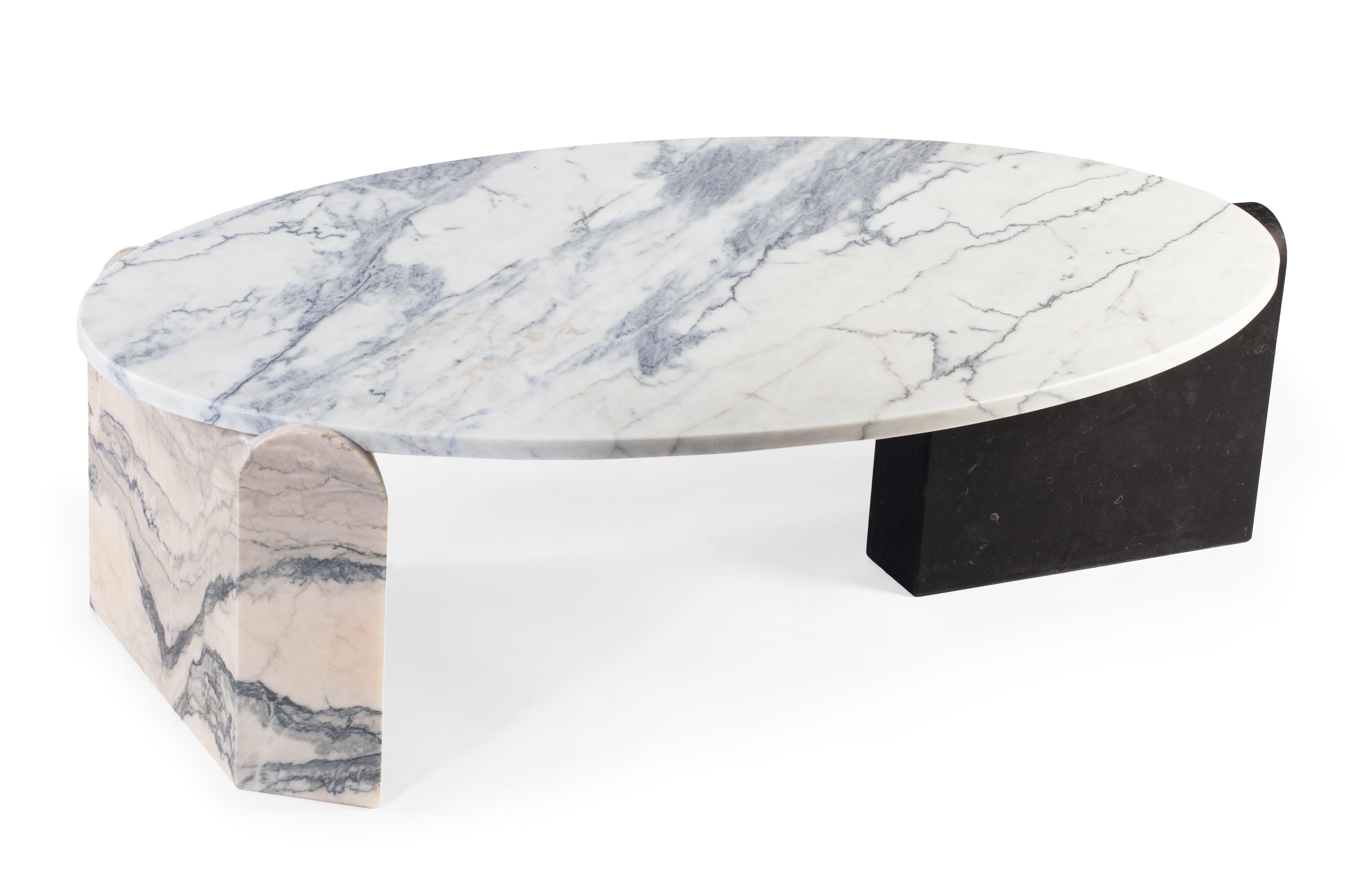 Marble contemporary jean center table
Dimensions: H 35 x W 120 x D 77 cm
Materials: Top: nero marquina; verde guatemala; extremoz rosa; extremoz
 Right base: Nero marquina; extremoz rosa; extremoz
 Left base: Nero marquina; extremoz rosa;