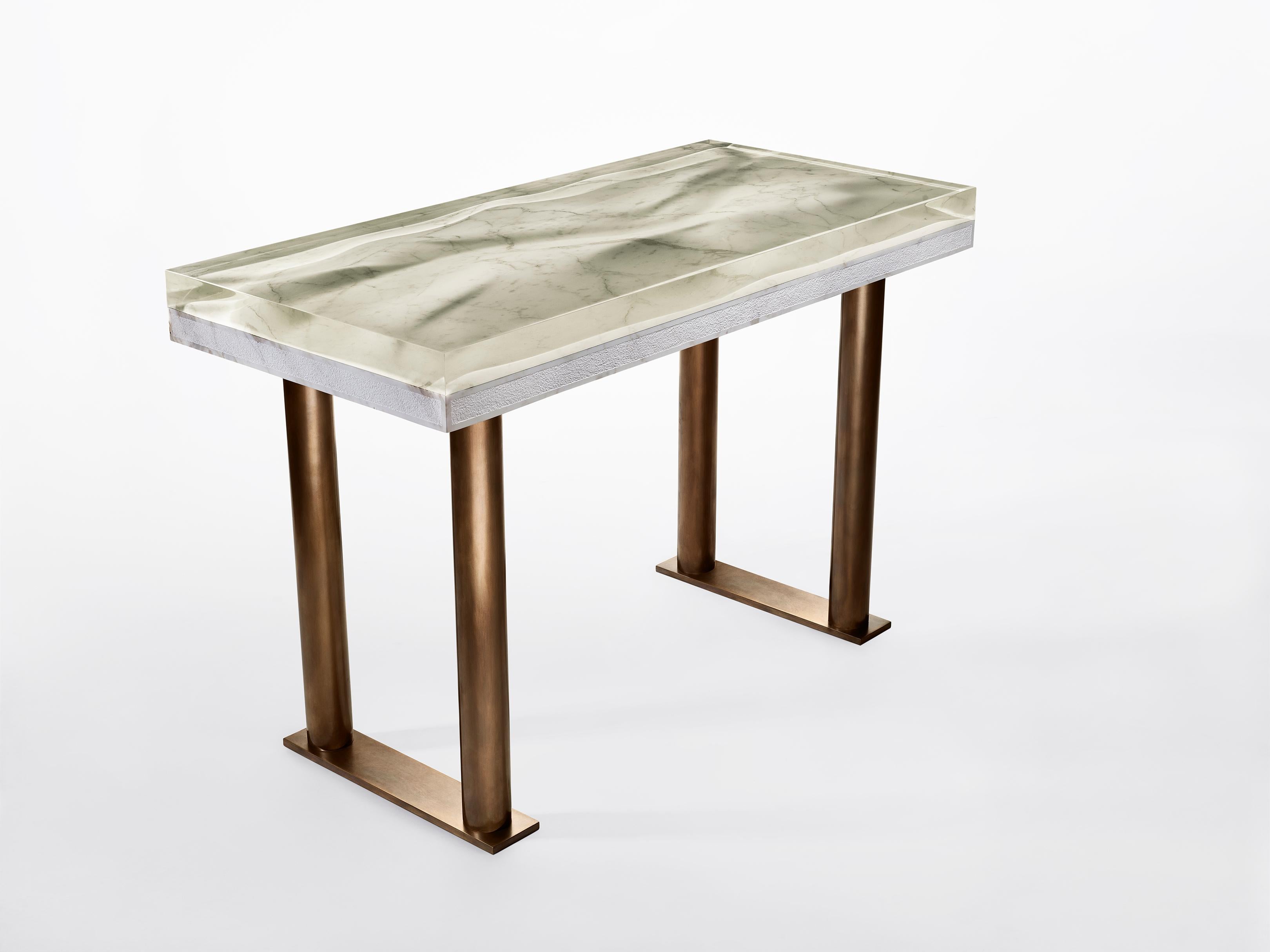 Marble desk by Jonathan Hansen
9 Editions + 1 AP
Dimensions: 116.8 x 55.9 x 76.2 cm
Materials: Calacatta marble, architectural bronze, Resin


Series I Captum Biomorfe is a group of nine sculpture works created by New York artist Jonathan