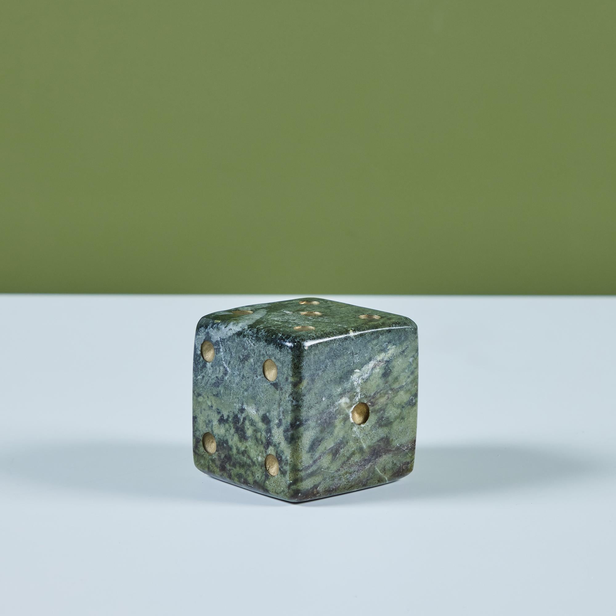 Green marble die. The die features a polished exterior stone with cream veining throughout.

Dimensions 
3