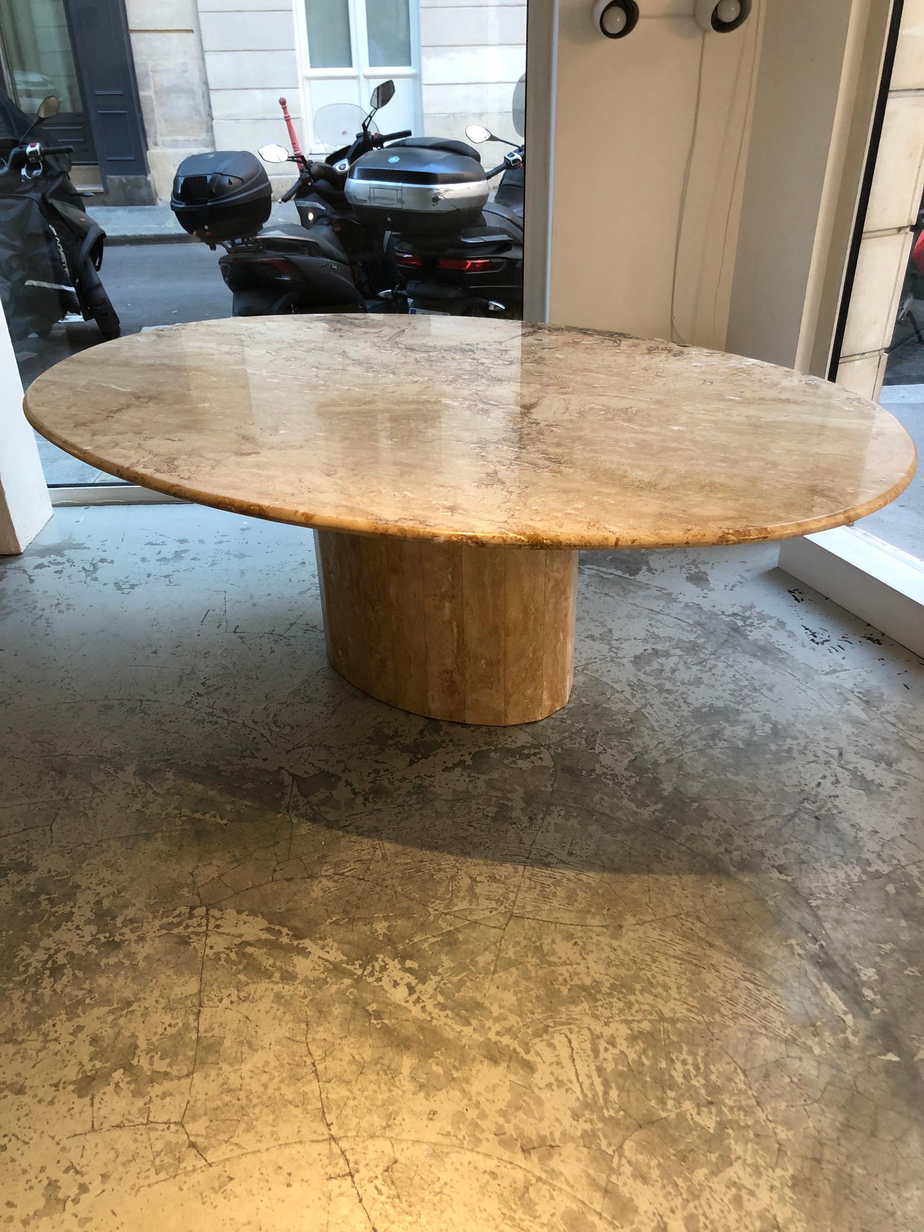 This table was designed in the 70s. The designer is unknown. 
The overall structure is in marble. The base is semi-full and its structure is formed by a set of facets.
The oval-shaped top is fitted directly into the base. 
In very good condition,