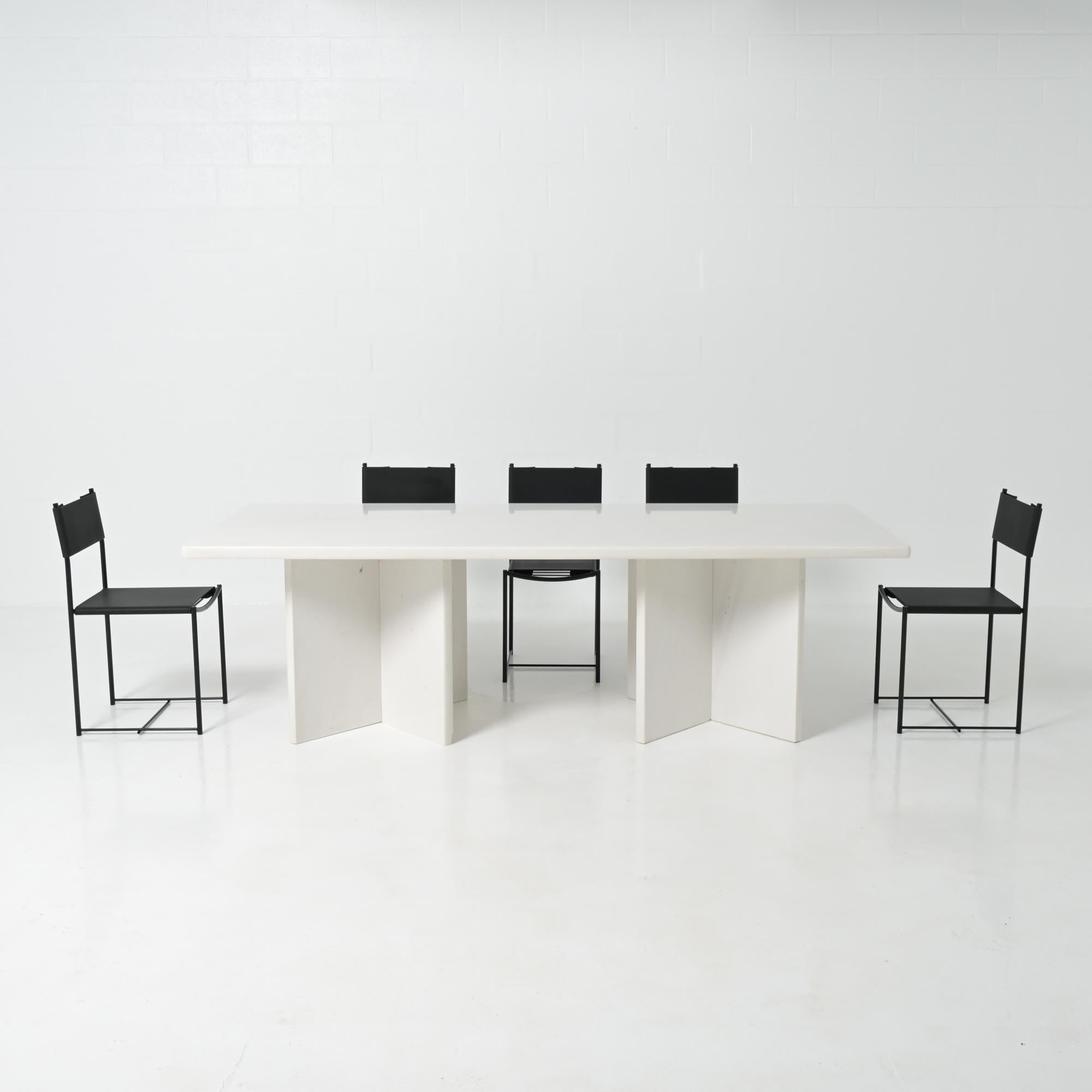 This minimalist marble dining table was crafted in the 1970s.

Its brutalist design will make a subtle yet strong addition to any interior.

The table consists of a solid marble tabletop supported by two marble crosses.

This piece is in good