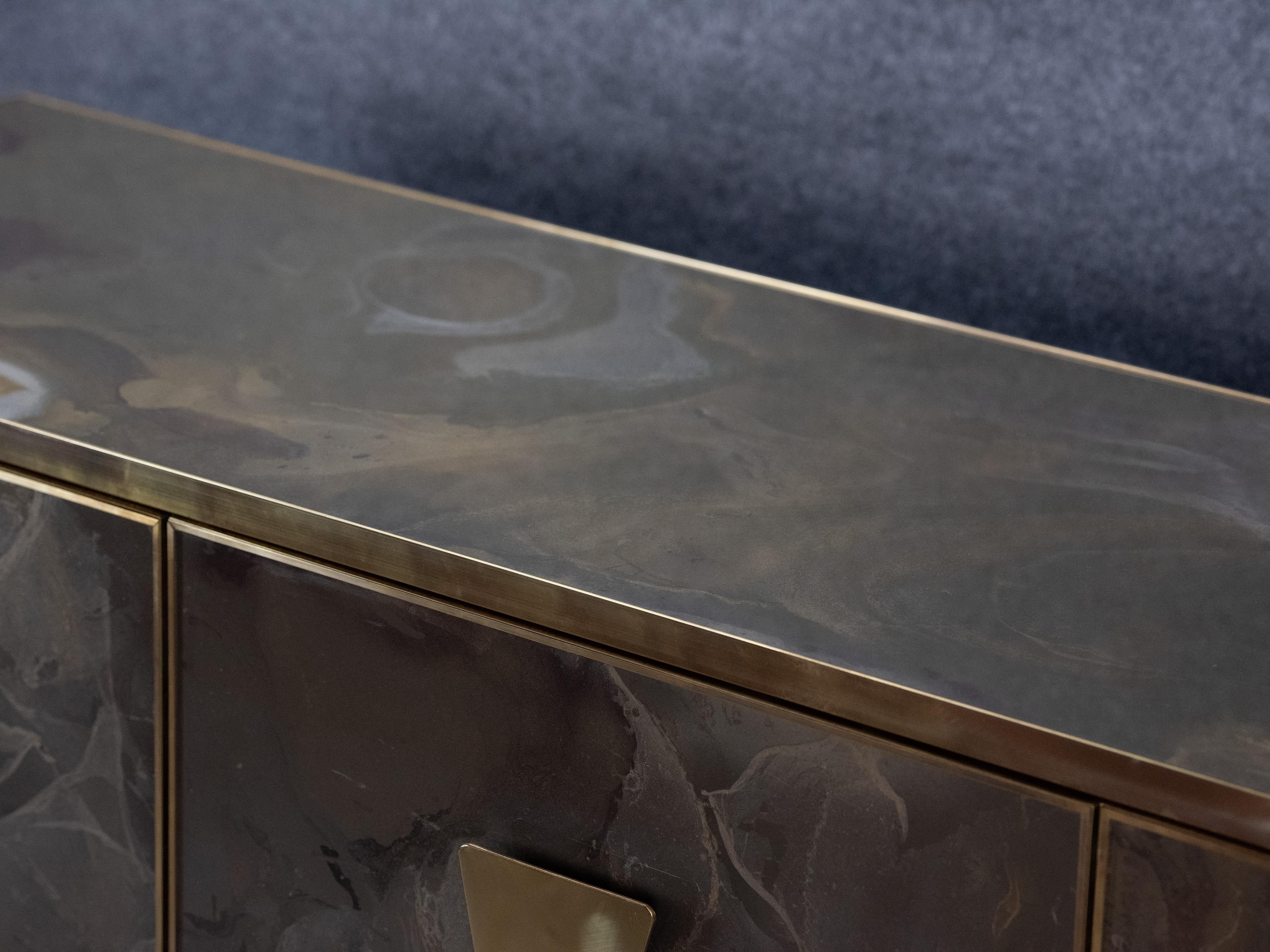 Our modern marble-effect glass sideboard is an eye-catching piece of mid-century modern furniture made with meticulous attention to detail in Italy. 

This elegant sideboard features a solid wood frame complemented by glass that gives the effect of