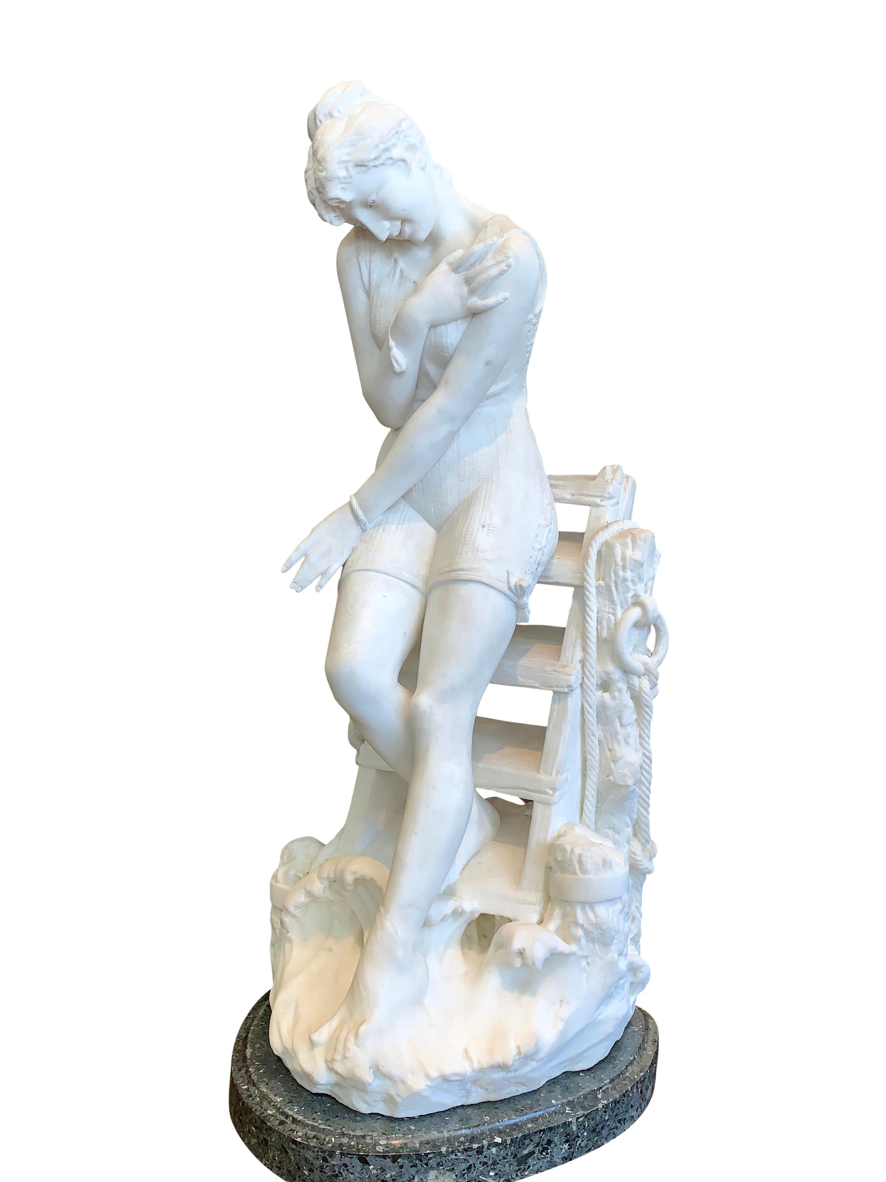 A magnificent large 19th century Italian carved marble figure of a young lady wearing a laced bathing suit, stepping down from an old dock to test the temperature of the water with her toes. Raised on its original green marble pedestal.
By Emilio