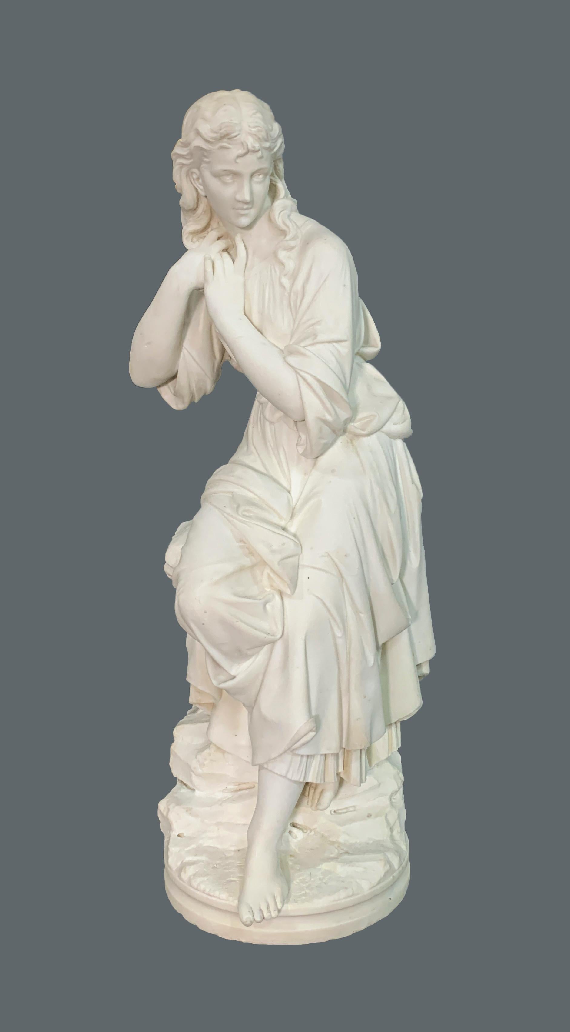 This magnificent Italian marble figure depicts a woman sitting atop a stone,
The details on her dress show it flowing carelessly by her feet, as she rests on an intricately designed rock. She carefully tussles her hair and looks off into the
