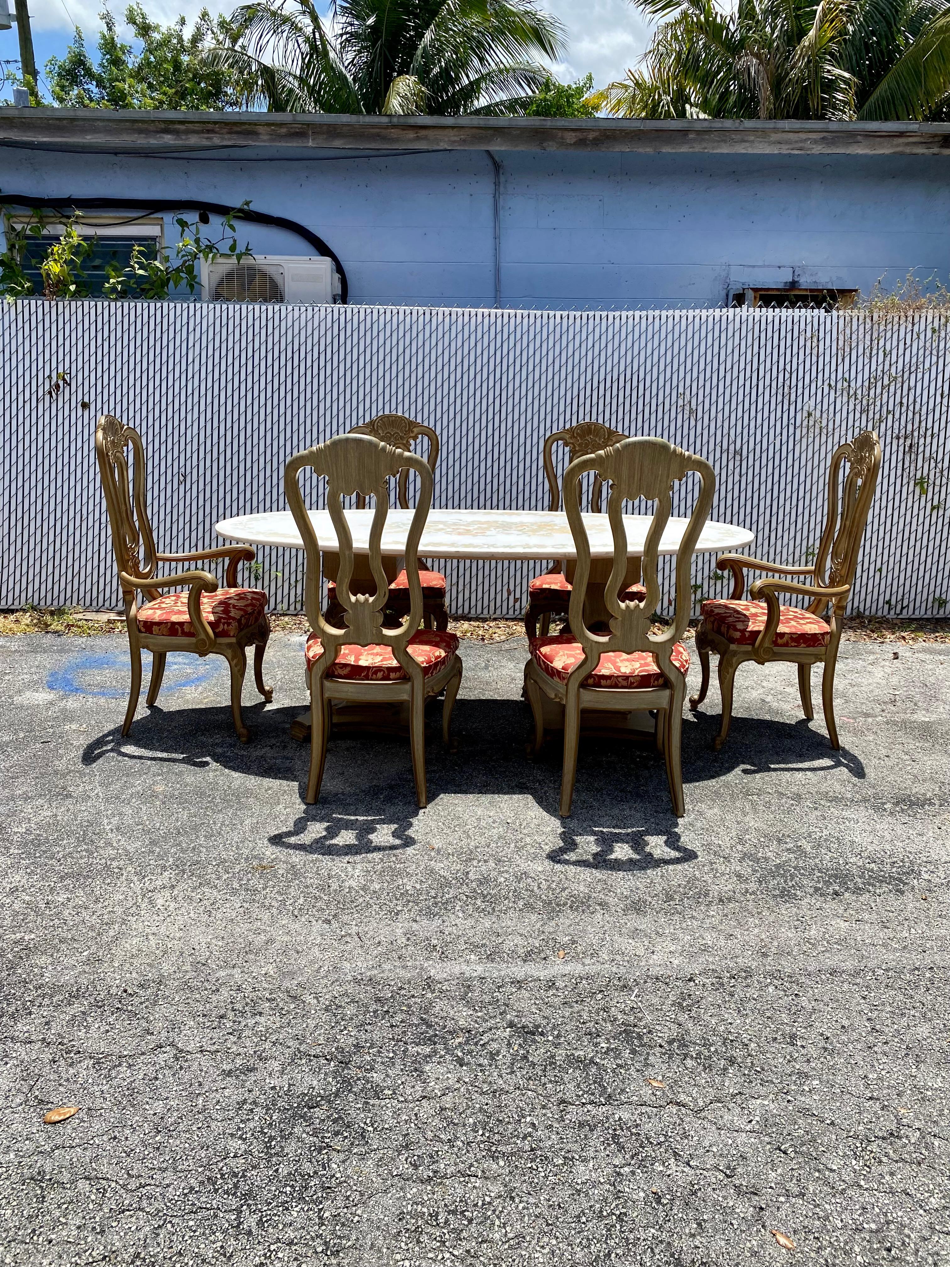 On offer on this occasion is one of the most stunning and rare, French Marble dining table and French Louis wood chairs set you could hope to find. In its original condition. No restoration. Outstanding design is exhibited throughout. The beautiful
