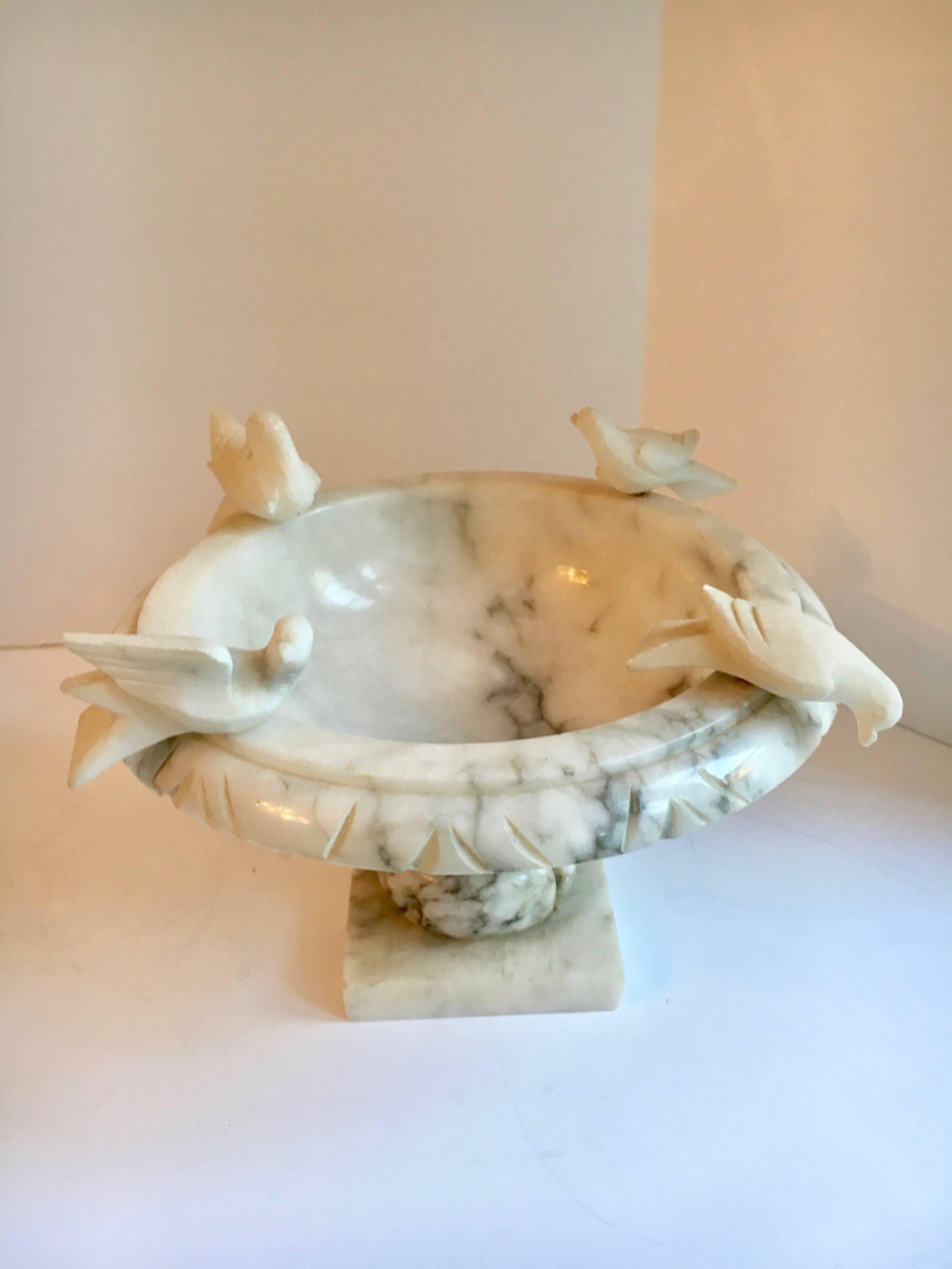Marble footed bowl with carved birds, reminiscent of a bird bath, this lovely bowl is perfect for everything from flower petals to fruit or herbs. Works in any room, indoor or out.