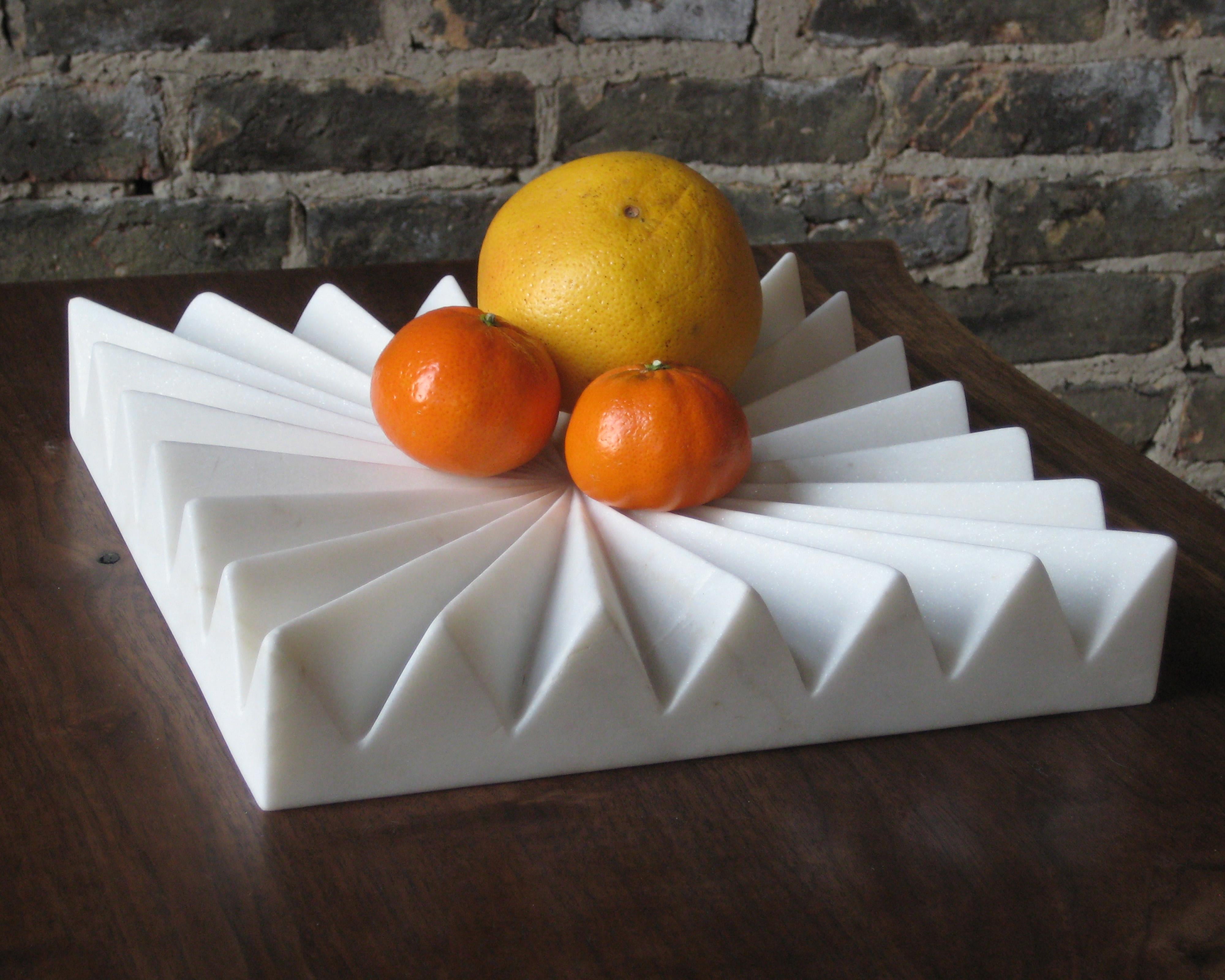 The spines of this fruit tray allow air circulate around fruit, extending its freshness. This tray is hand-carved by traditional stone artisans in Rajasthan State, India.

Founded in 2011, AKMD developed out of a thirteen-year friendship and design