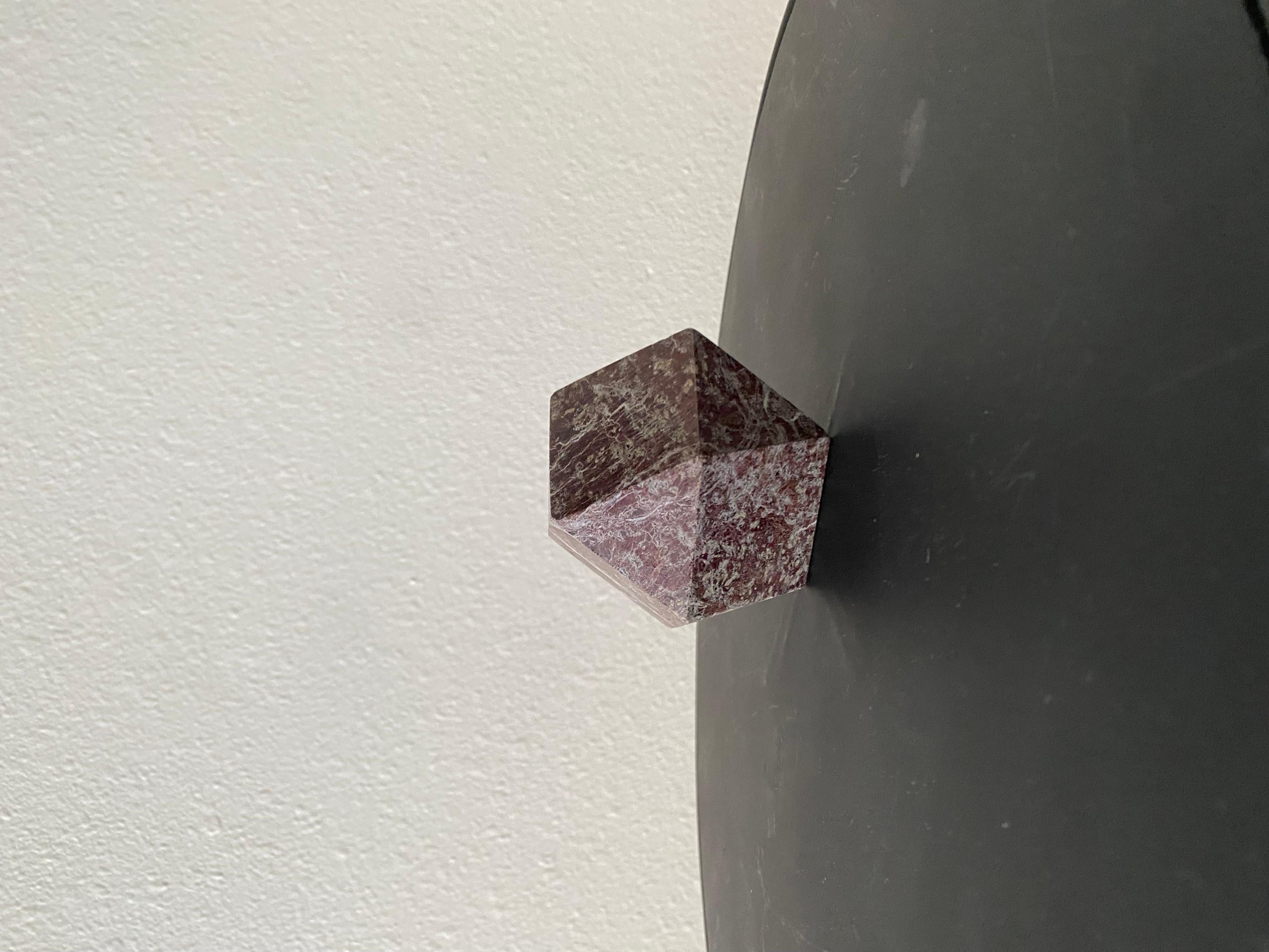 A lovely small Marble Geometric Sculpture boasting red and grey colors. An amazing addition to any office or living area.