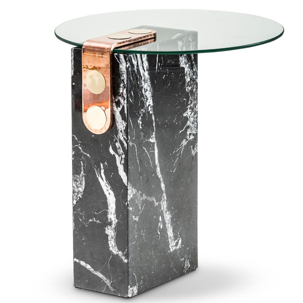The marble patch side table is part of the Patch collection by Egg Designs. Patch makes reference to the brass fixing mechanism which was design by Egg Designs and is used on many of their furniture pieces. The side table has a base of marble with a