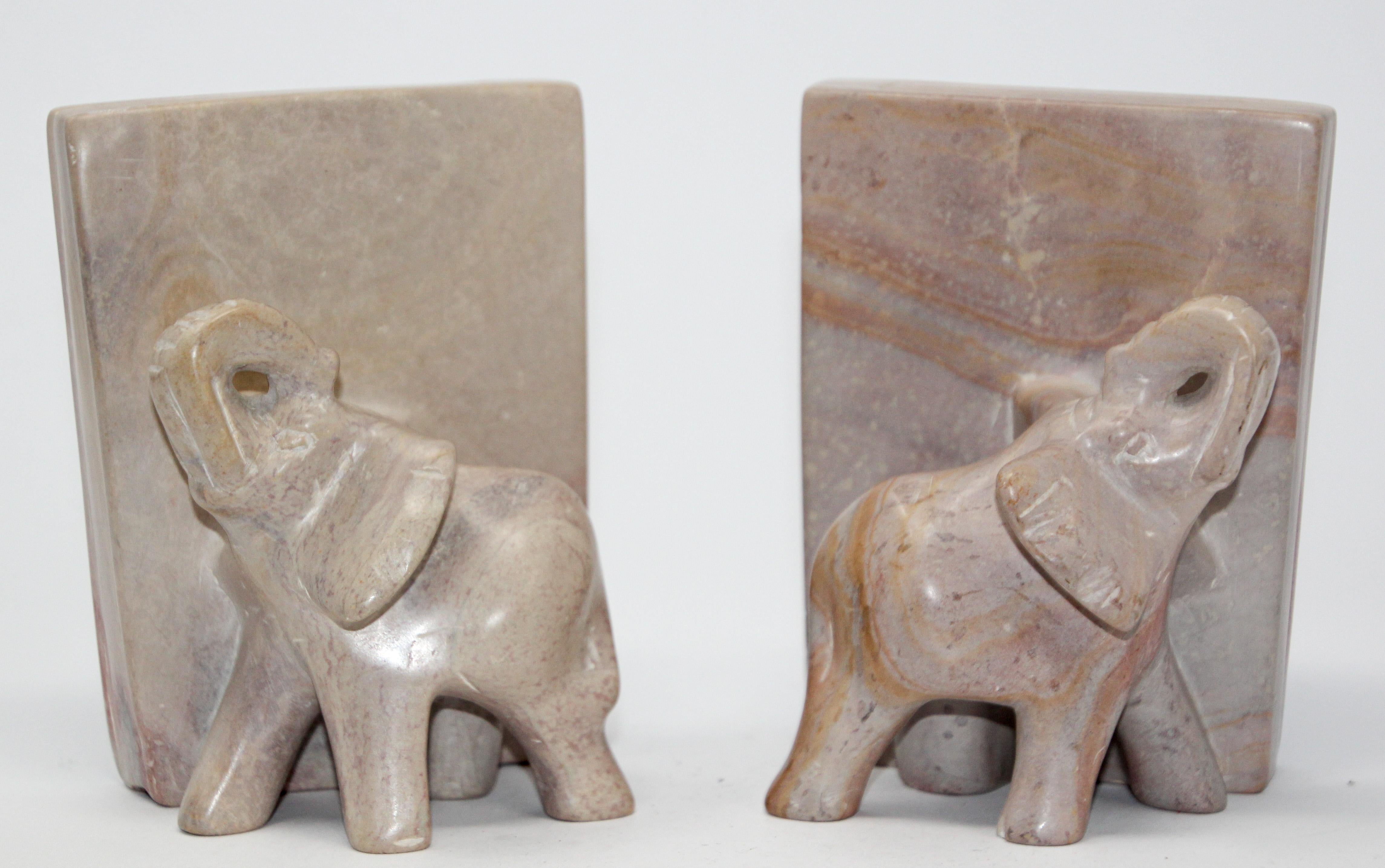 Nice vintage pair of hand carved marble elephant bookends.
Vintage bookshelf decor elephants bookends animal sculpture.
These are hand carved and therefore not completely identical,
circa 1950
Elephant with trunk up are good luck.
Each book end