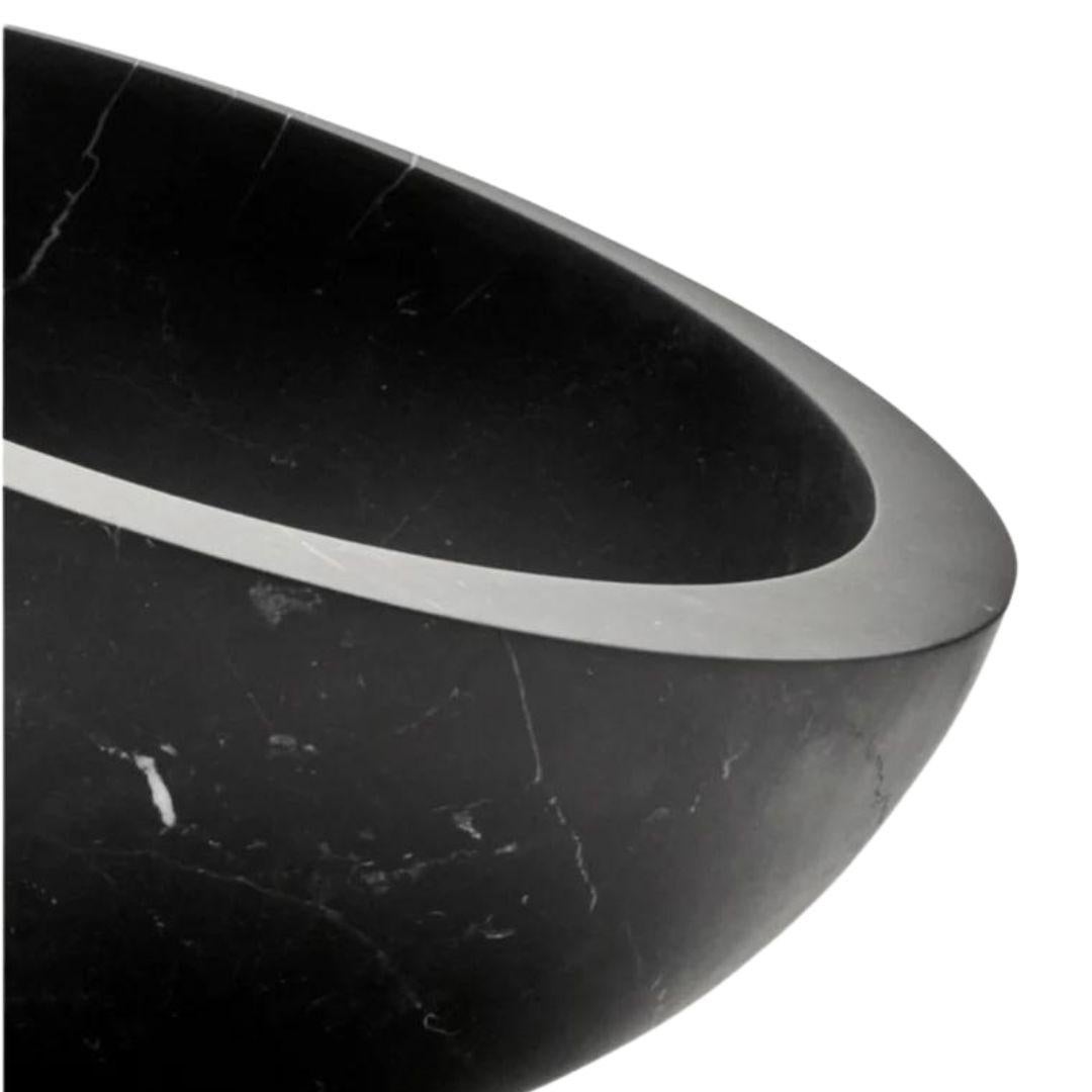 This marble bowl designed by British architect John Pawson is created as a seamless hemisphere for When Objects Work. 

The dynamic base allows the bowl to rest on a curve creating the illusion of imbalance. Its minimalist design is an eye-catcher