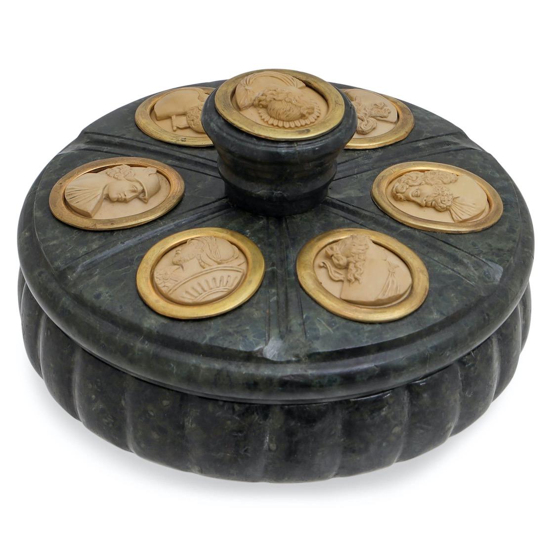 Round lidded vessel made of green marble with embedded inkwell, sprinkling barrel and brass holders. Lid with gouache painting of Naples. The lid with a round knob is divided into segments and decorated with cameos, which represent different gods in