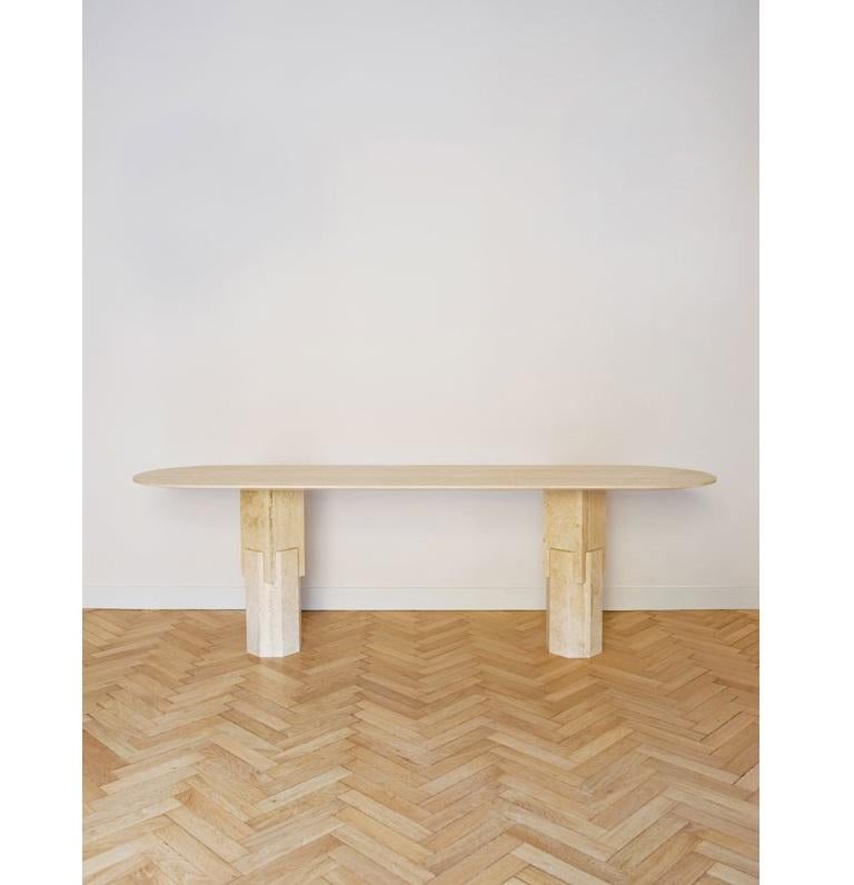 Marble Ionik console by Oeuffice
Edition of 8 + 2AP
2015
Materials: Roman travertine stone
Dimensions: L 220 x W 60 x H 68 cm.

Kapital is a series of limited edition tables and stools based on essential forms, reminiscent of primordial stone
