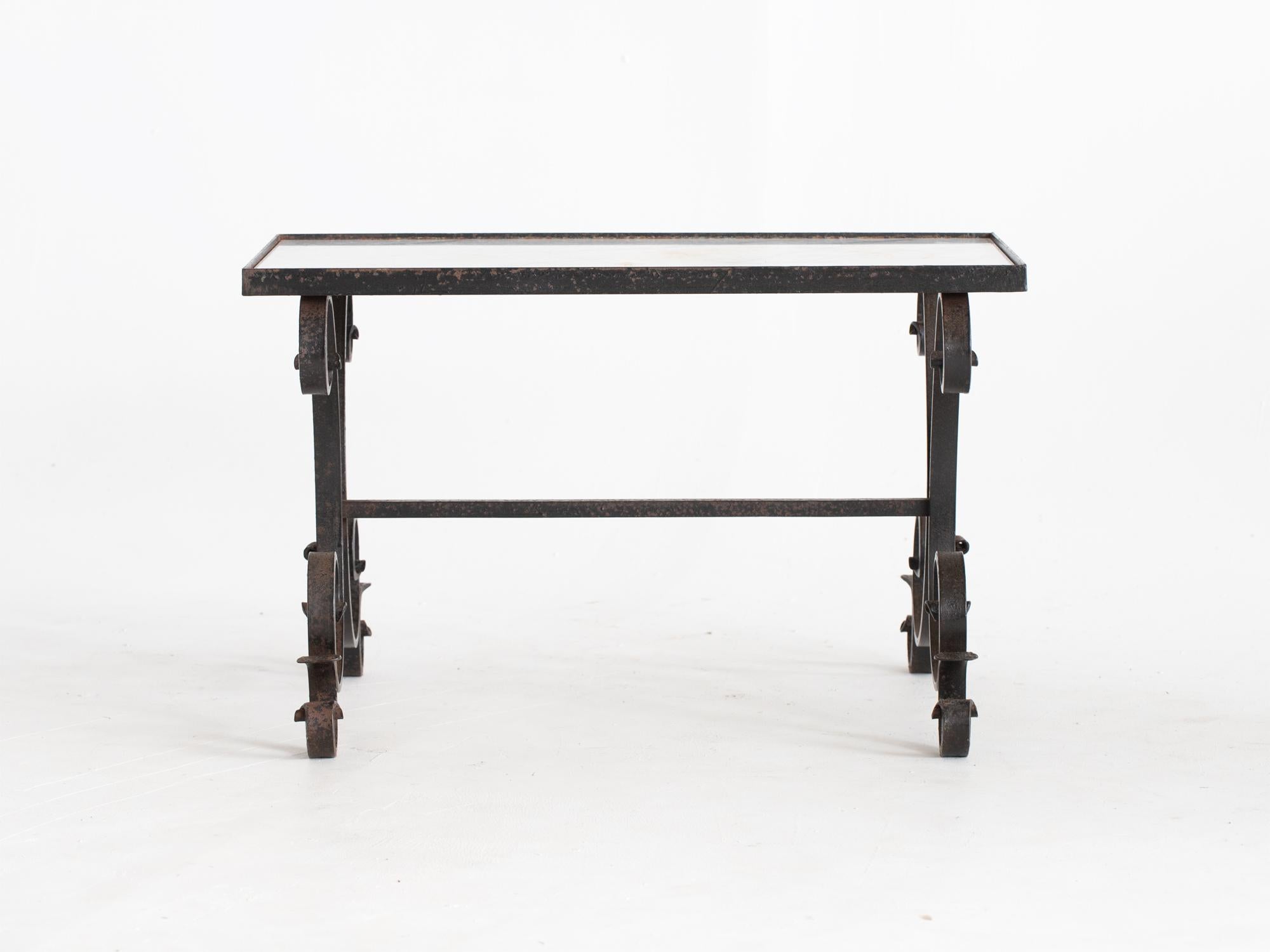 A forged iron coffee or side table with Carrara marble top. French, c. 1950s.

Stock ref. #2248

44.5 x 71 x 52 cm (17.5 x 28.0 x 20.5 