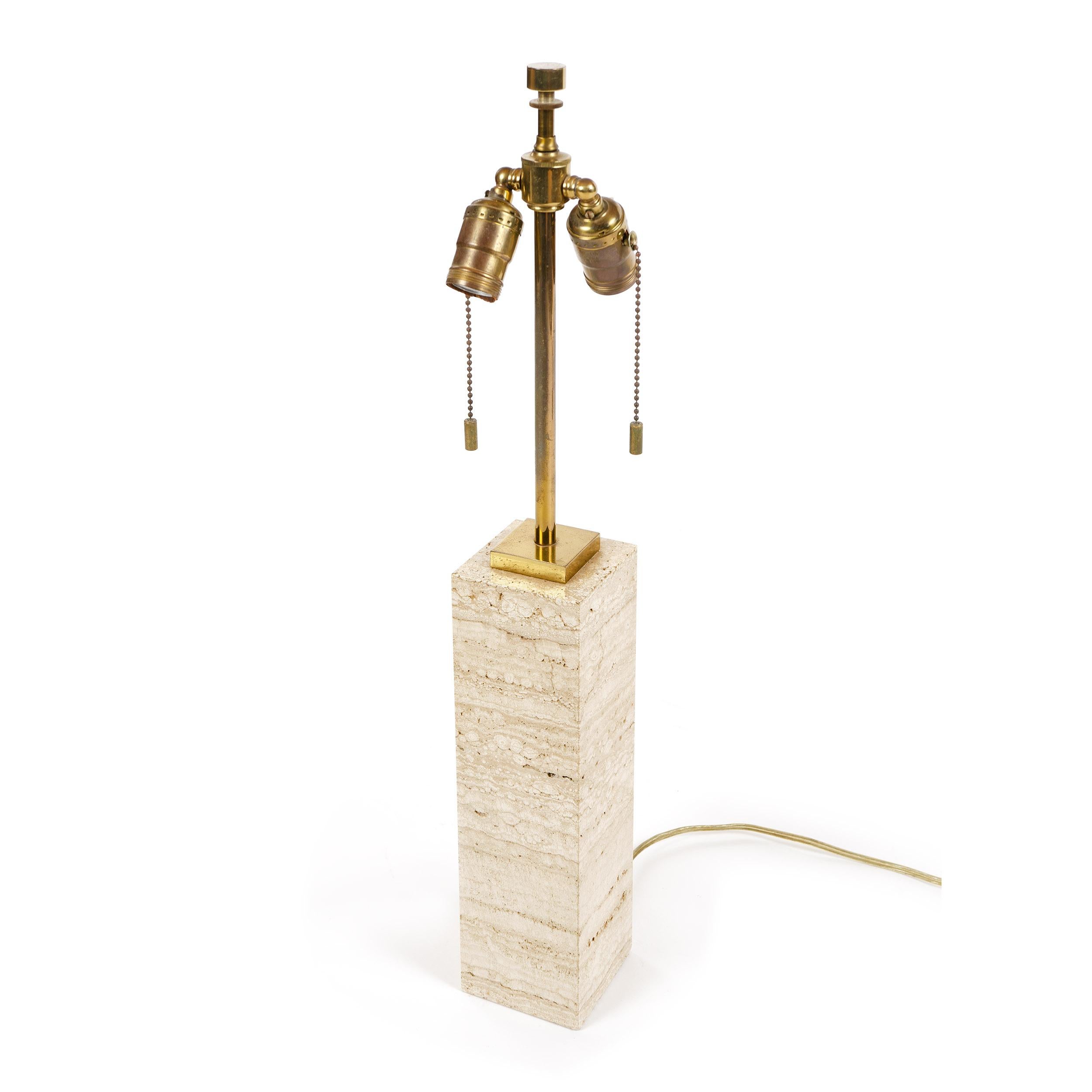 A Mid-Century Modern rectangular beige marble table lamp with patinated brass hardware. Designed by T. H. Robsjohn-Gibbings and manufactured by Hansen in the USA, circa 1960s.