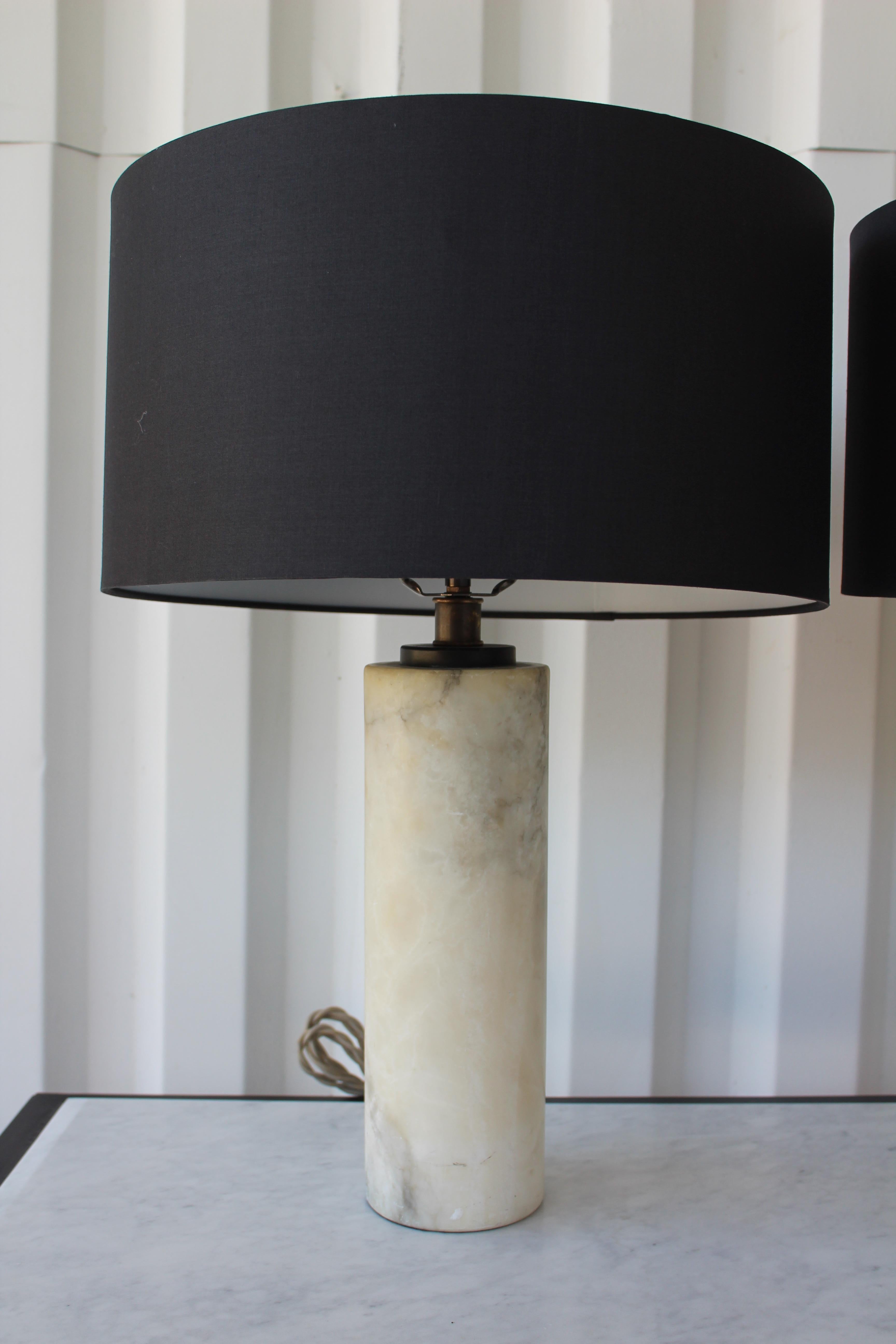 Pair of vintage midcentury marble lamps, Italy, 1950s. The pair have been rewired and include their custom made black silk shades. Sold separately.
Base is 4 inches diameter, shade is 15 inches diameter. Total height of 21 inches.