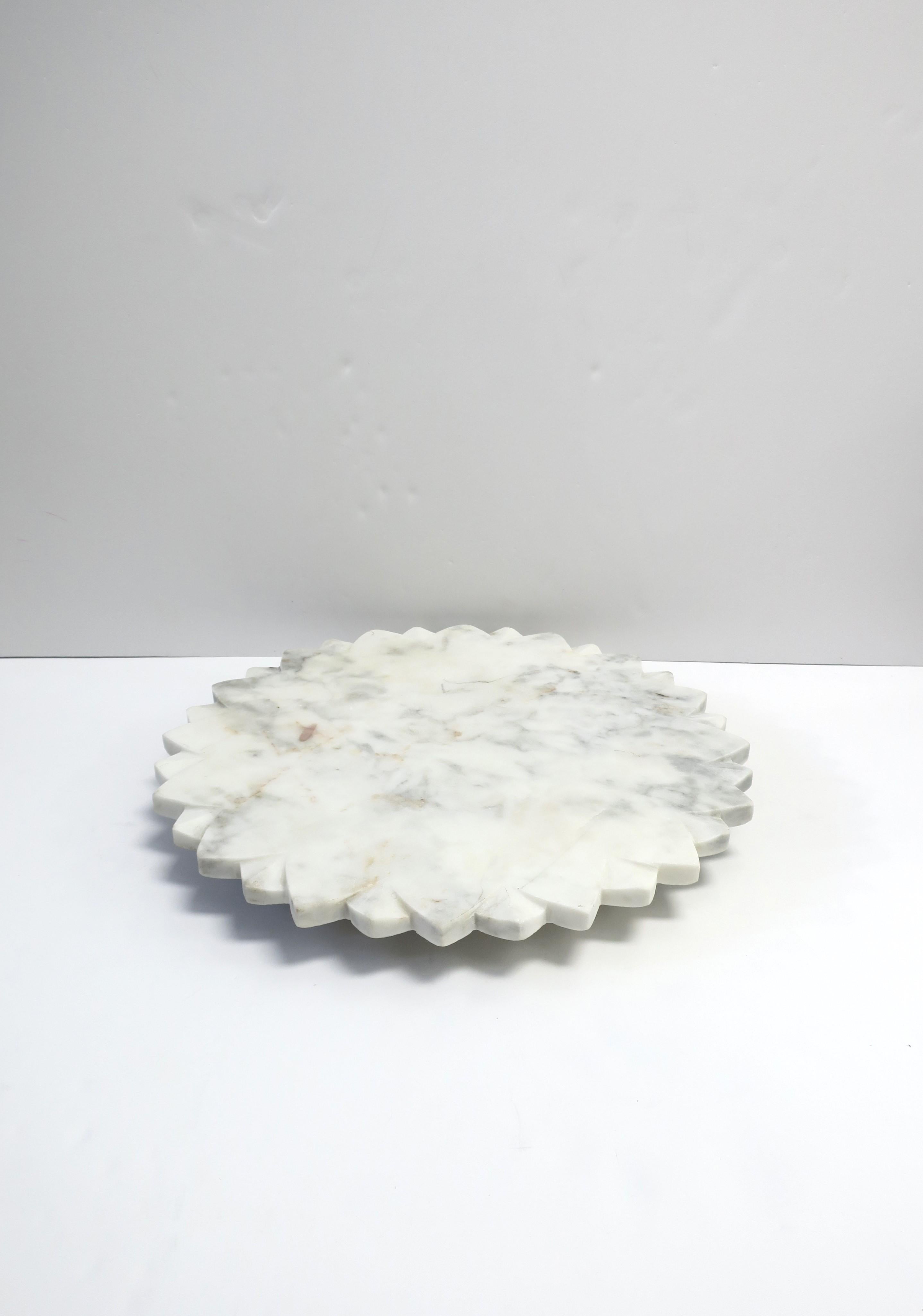 A substantial, predominantly white, marble Lazy-Susan with star-like design, circa 21st century. Marble is white with grey and light-burgundy red veining/hues. A great piece for a kitchen, bar, entertaining area, etc. Use it to hold salt/pepper,