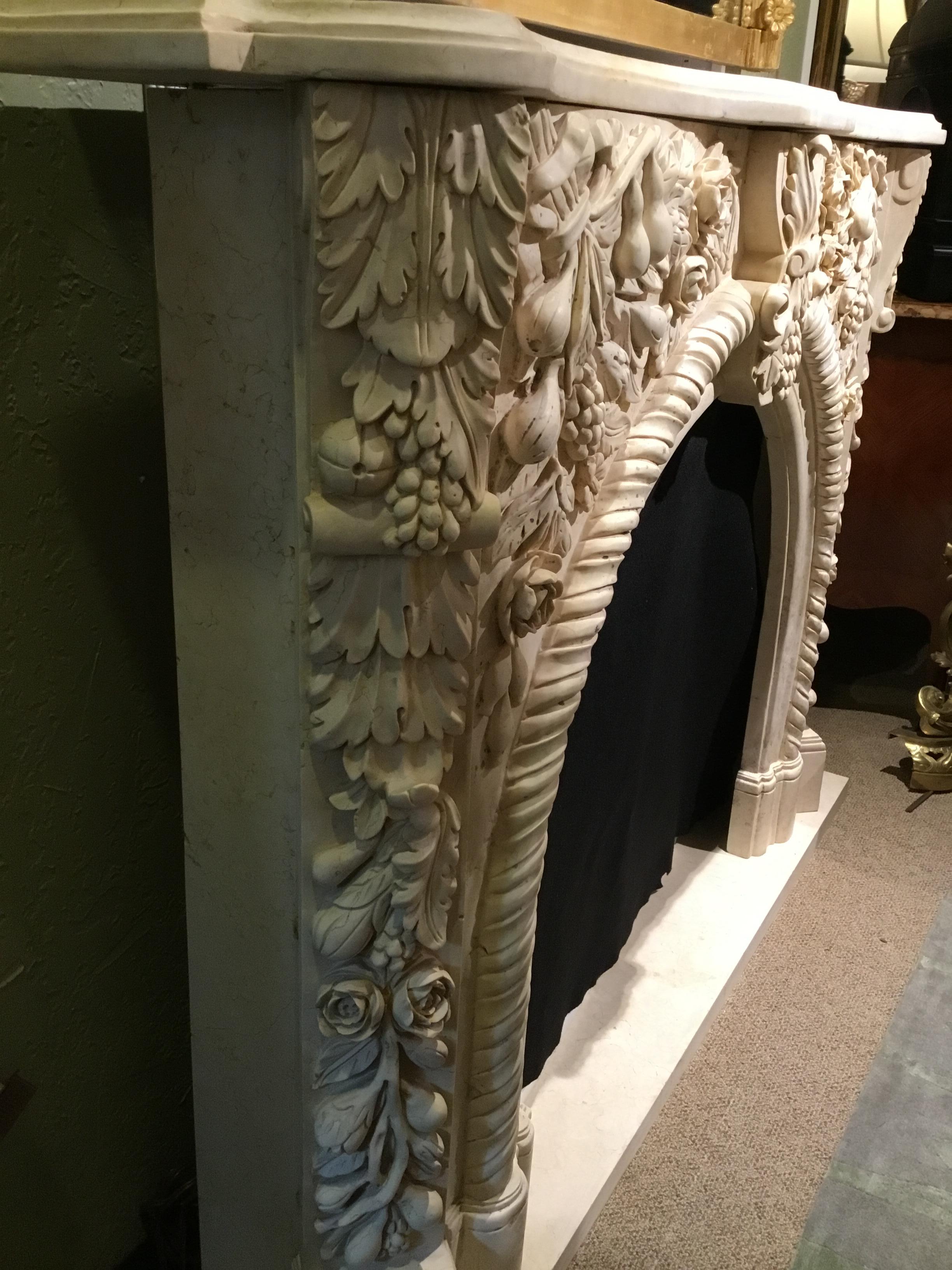 Marble Mantel in Pale Gold, Hand Carved with Fruit Flowers and Foliate Design In New Condition In Houston, TX