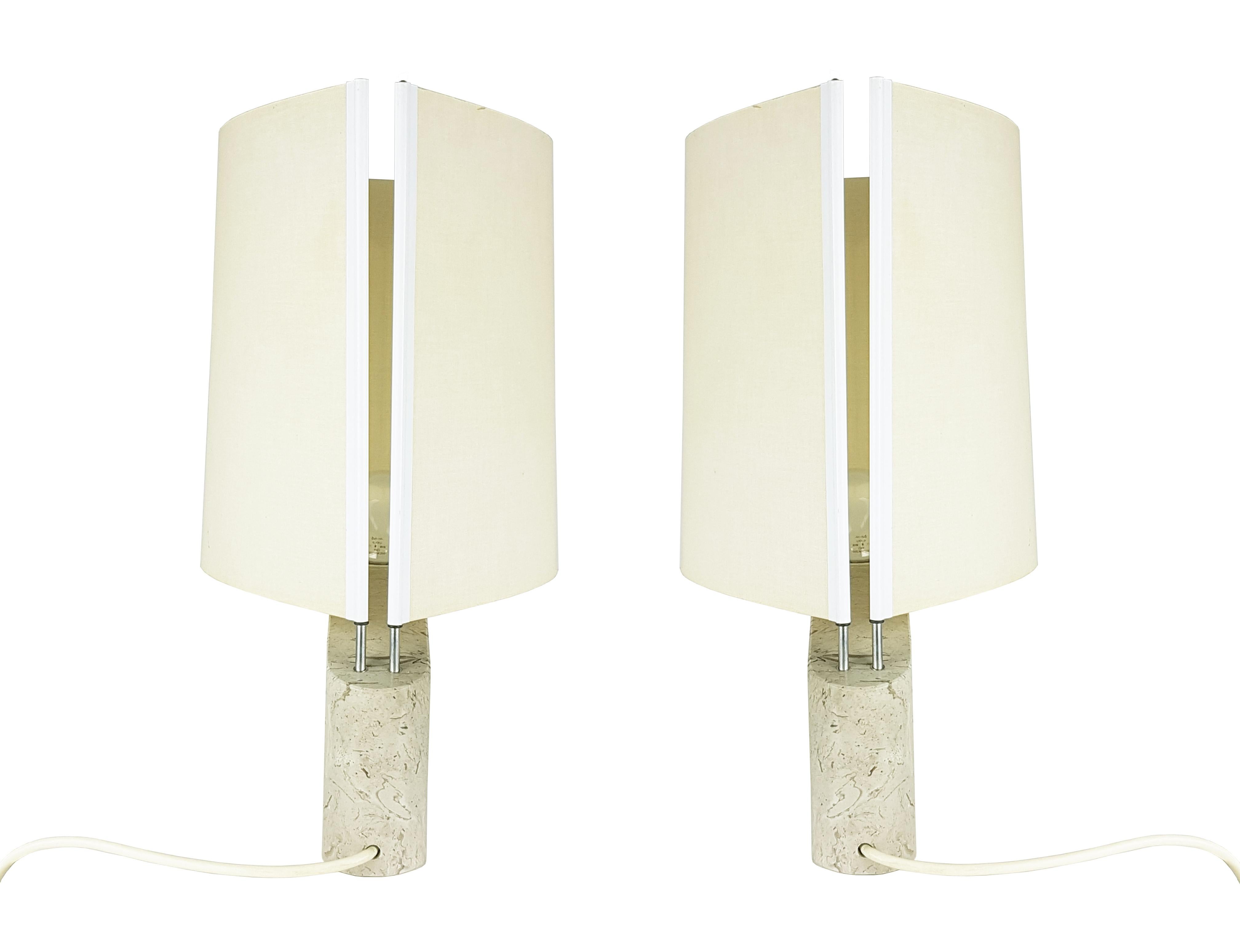 Pair of beautiful and elegant table lamps from the Italian manufacturer Ibis.
This set was produced between the 70s and 80s with a marble base, metal rods and lampshades in plasticized fabric.
the lamps are also suitable for placing on bedside