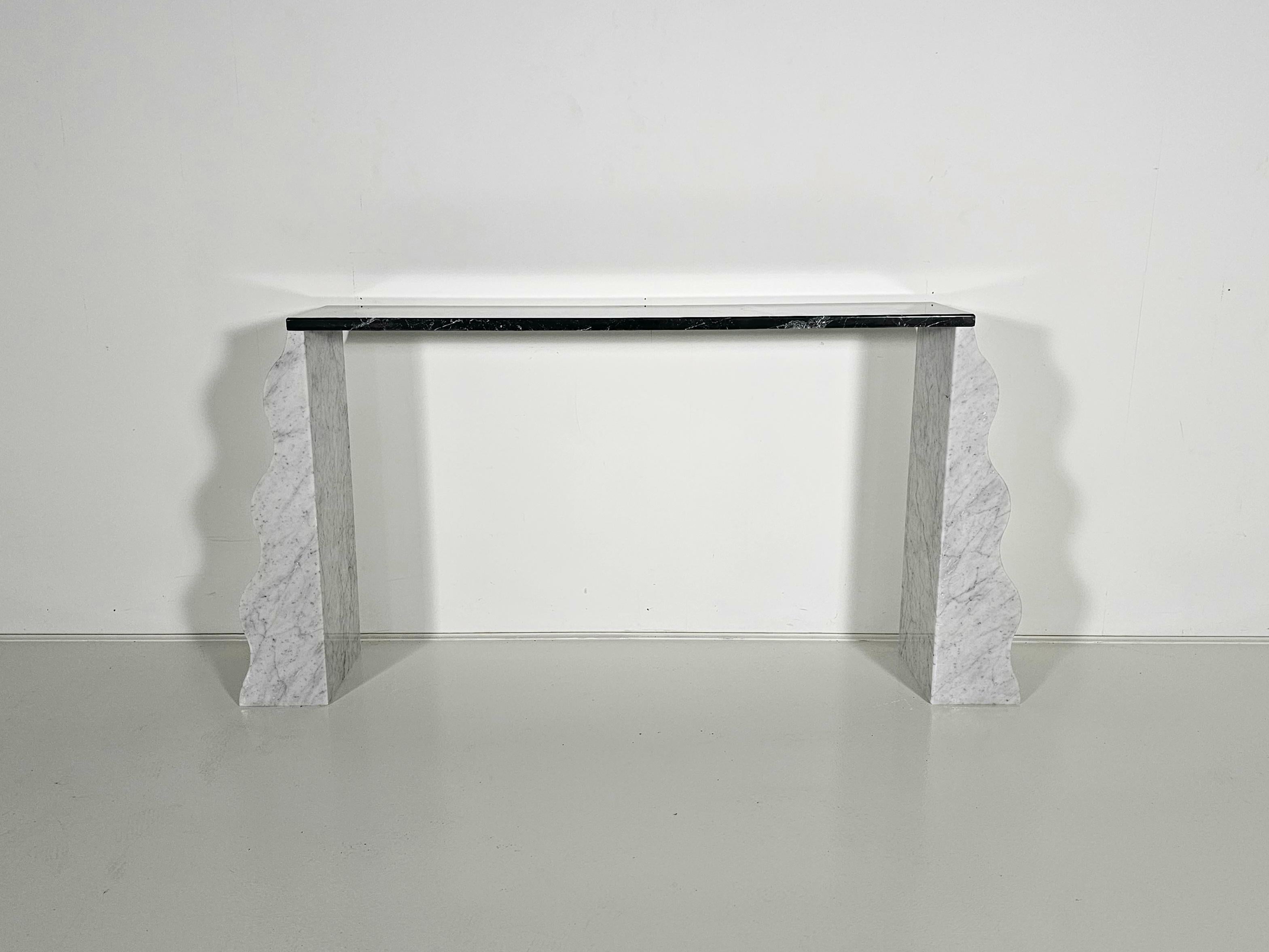 Marble console table, Montenegro model, by Ettore Sottsass, Ultima Edizione, Italy, 1980

The top is made of black marble and held by two white marble pedestals. Iconic designer Ettore Sottsass created the Montenegro console table in 1980 and shows