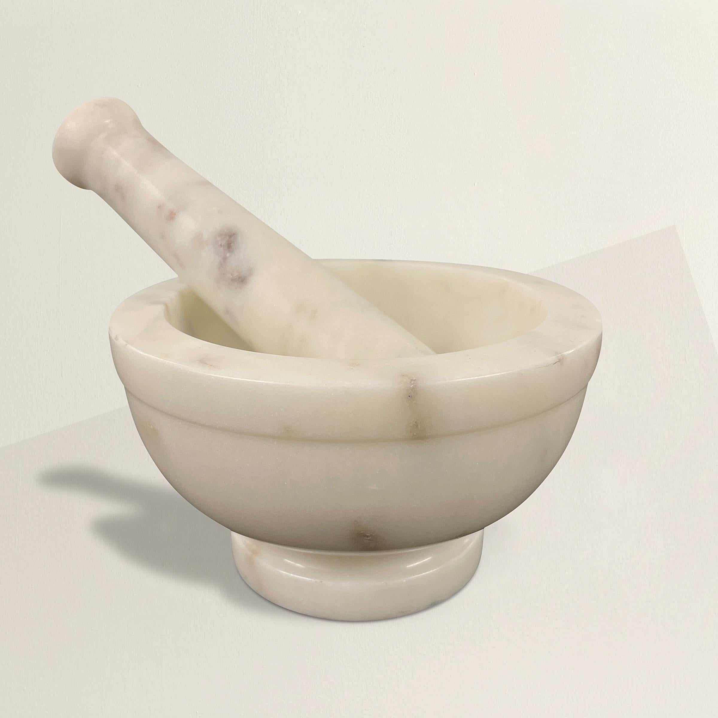 A chic marble mortar with a marble pestle, big enough to crush even the largest of spices, but small enough to keep on your kitchen counter and filled with salt or pepper so it's always on hand.