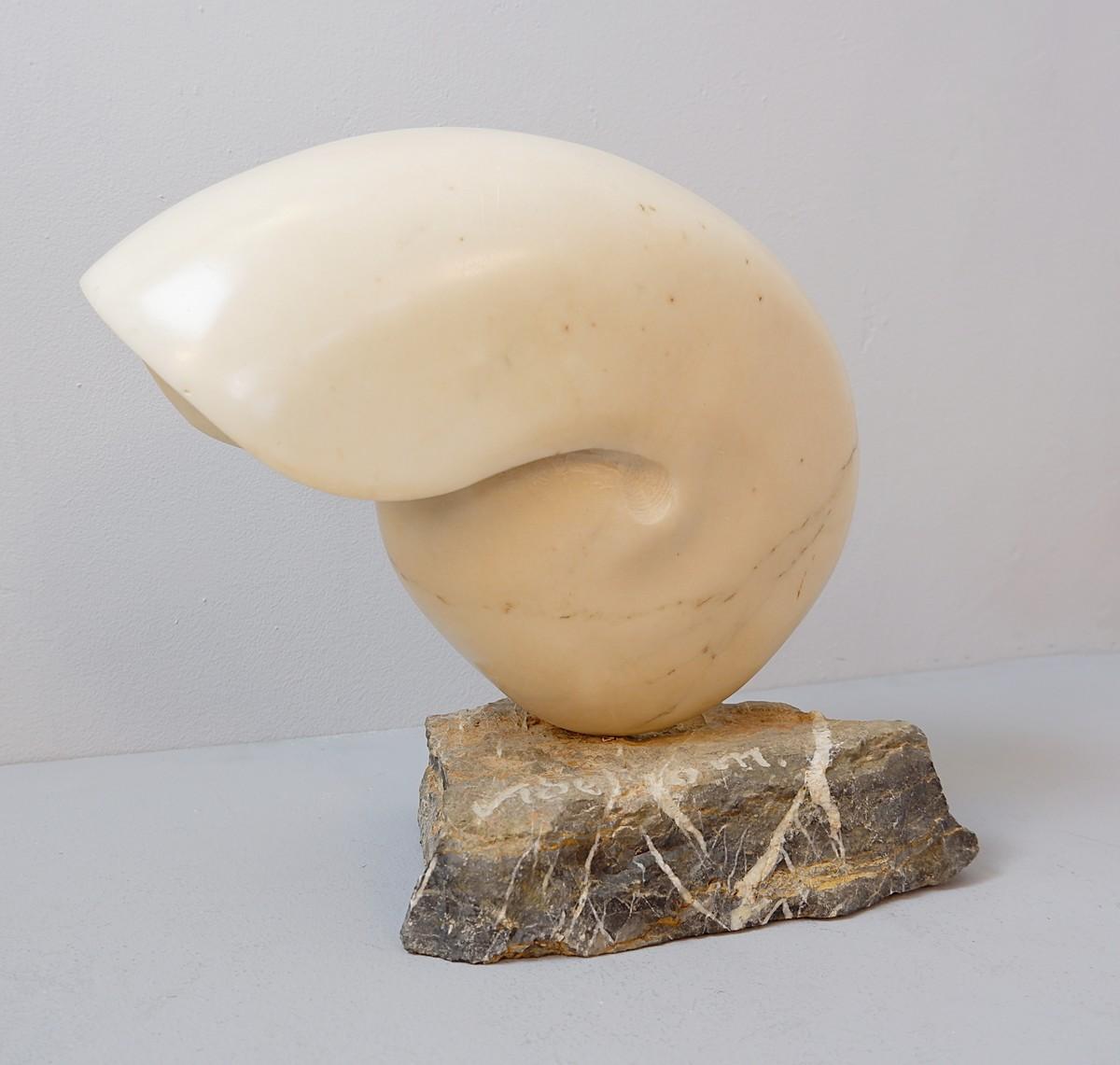 Marble nautilus shell sculpture, signed.