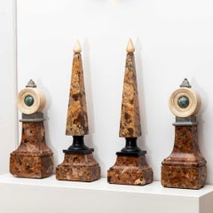Set of four Red Marble Obelisks and Ornaments, 19th century