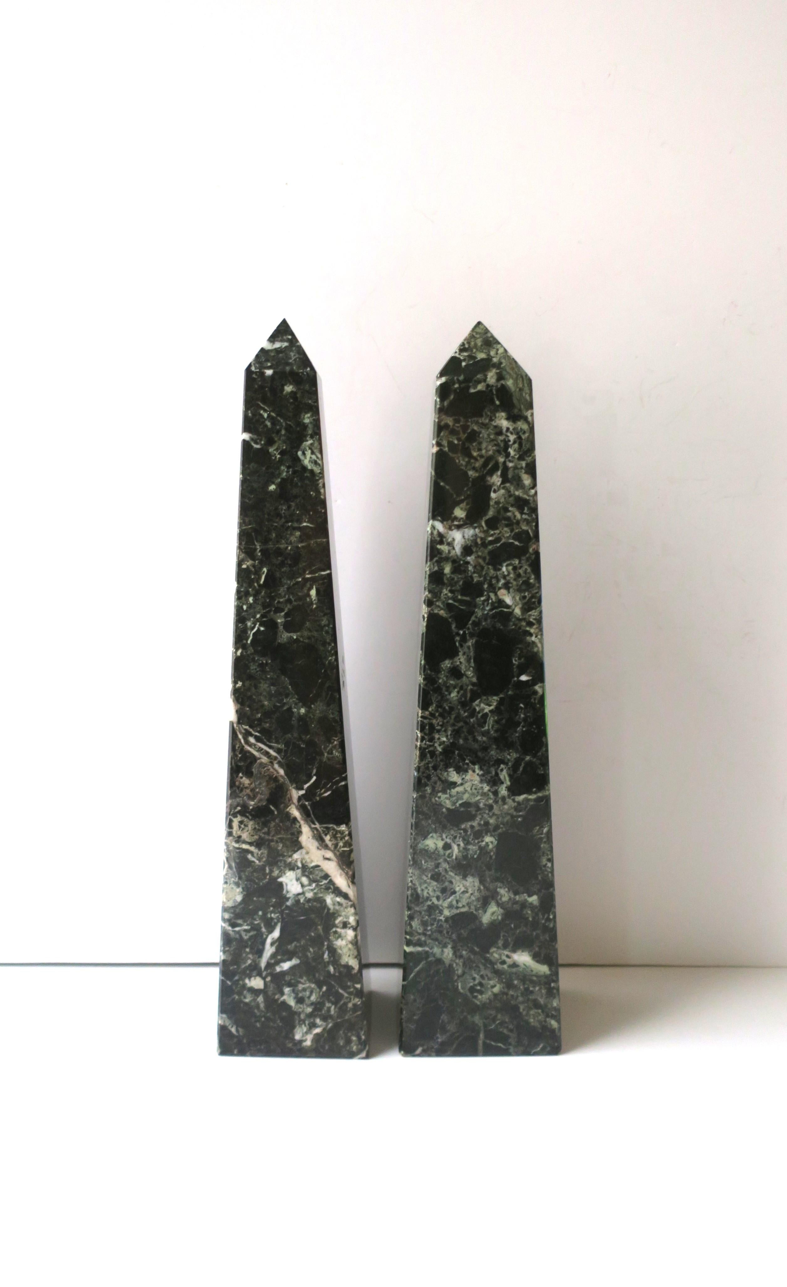 A substantial pair of marble Obelisks, in the Modern style, circa mid-20th century. Pair are a very dark green, forest green, with white and light-green veining. Very good condition as shown in images. No chips noted. Dimensions: 3.19