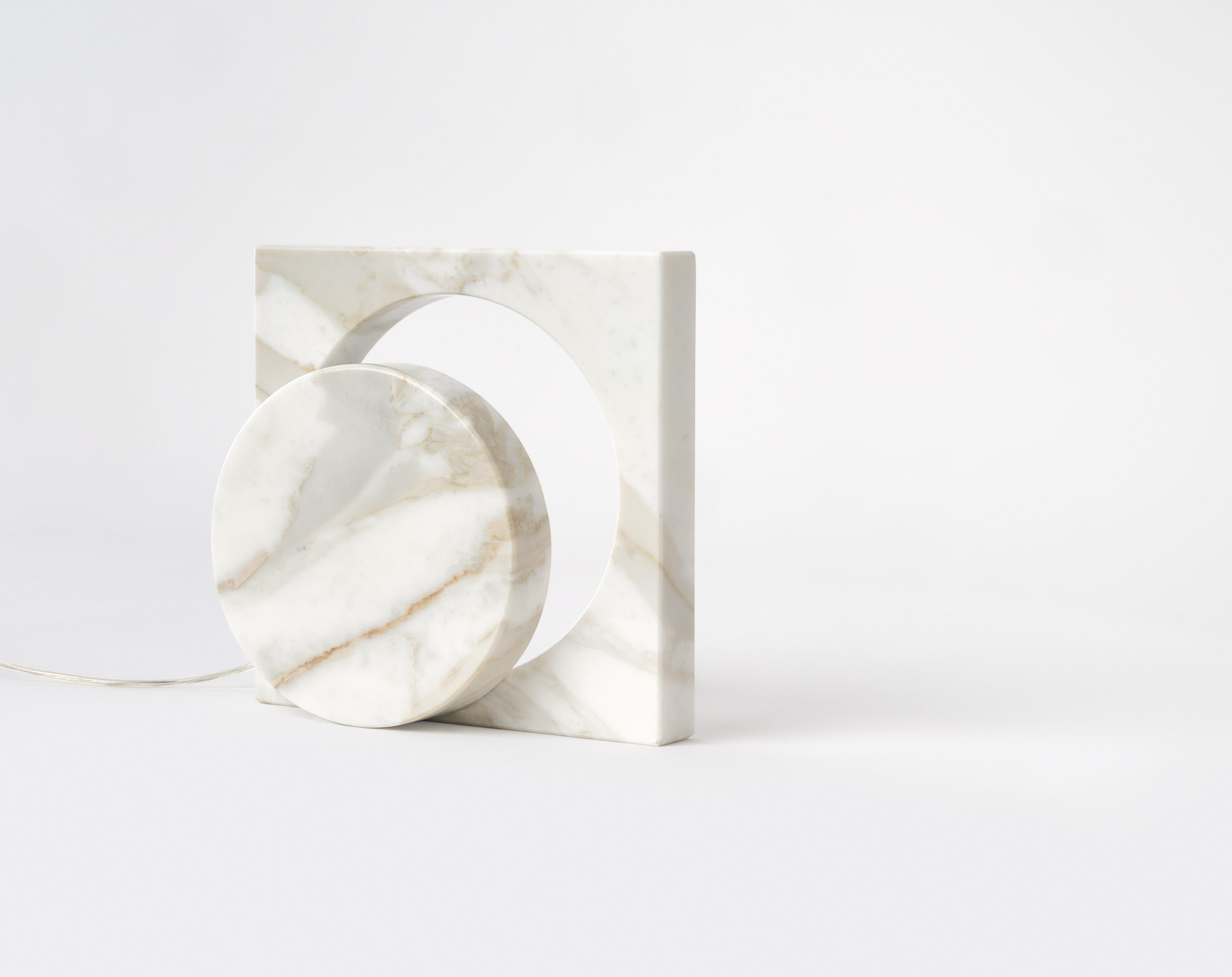 Marble One Cut Moon table lamp- Moreno Ratti
Dimensions: D 9 x W 20 x H 20 cm
Materials: Calcata Oro marble.

All our lamps can be wired according to each country. If sold to the USA it will be wired for the USA for instance.

The idea of this