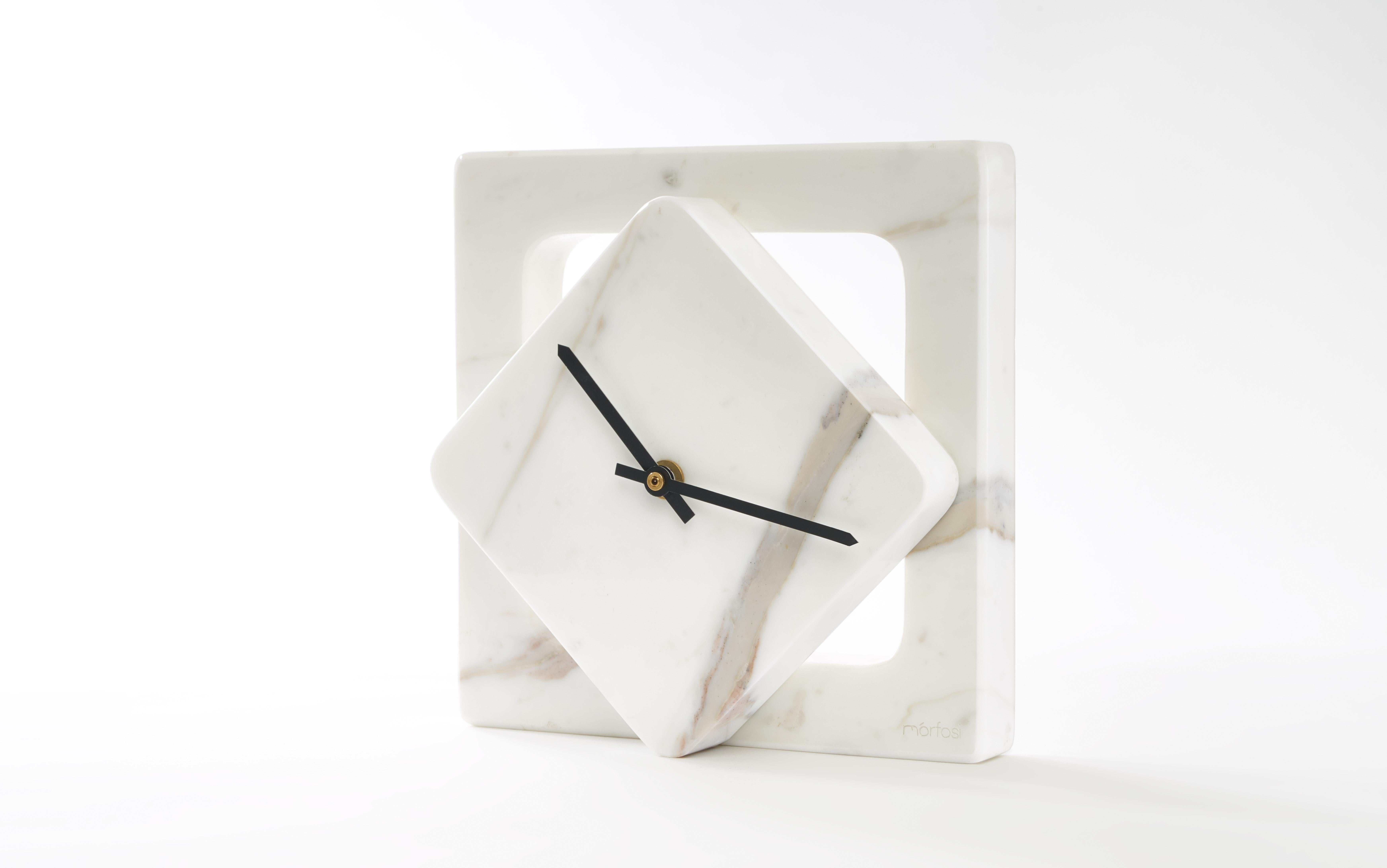Marble One Cut table clock - Moreno Ratti
Dimensions: D 9 x W 20 x H 20 cm
Materials: Calcata Oro marble.

The idea of this collection comes from the desire to take the concept of minimalism to the extreme, as in the Recisi series: a single cut